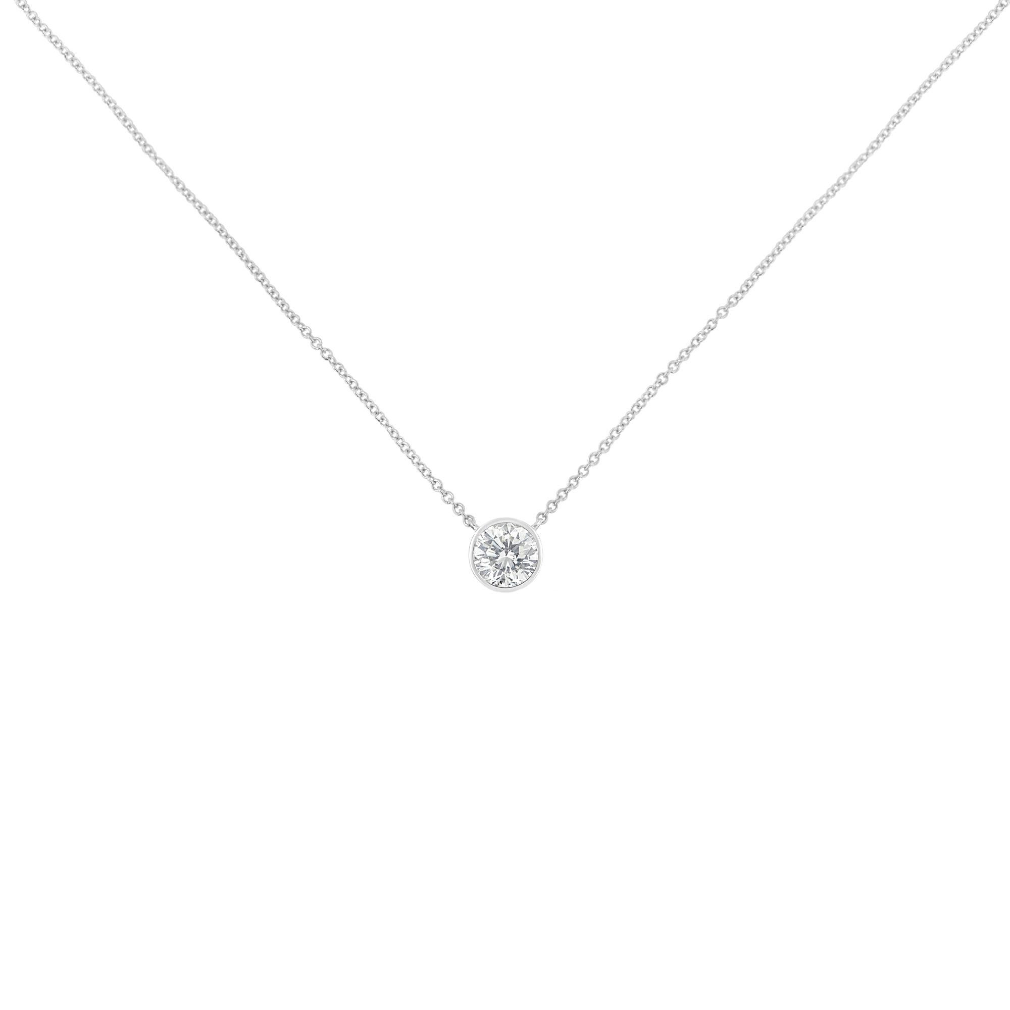 A twinkling 1/5ct round diamond rests in a soft bezel setting. Anchored on each side, a cable chain holds the pendant in place. This 10k white gold necklace is the perfect option for everyday wear. This beautiful necklace includes 18” cable chain