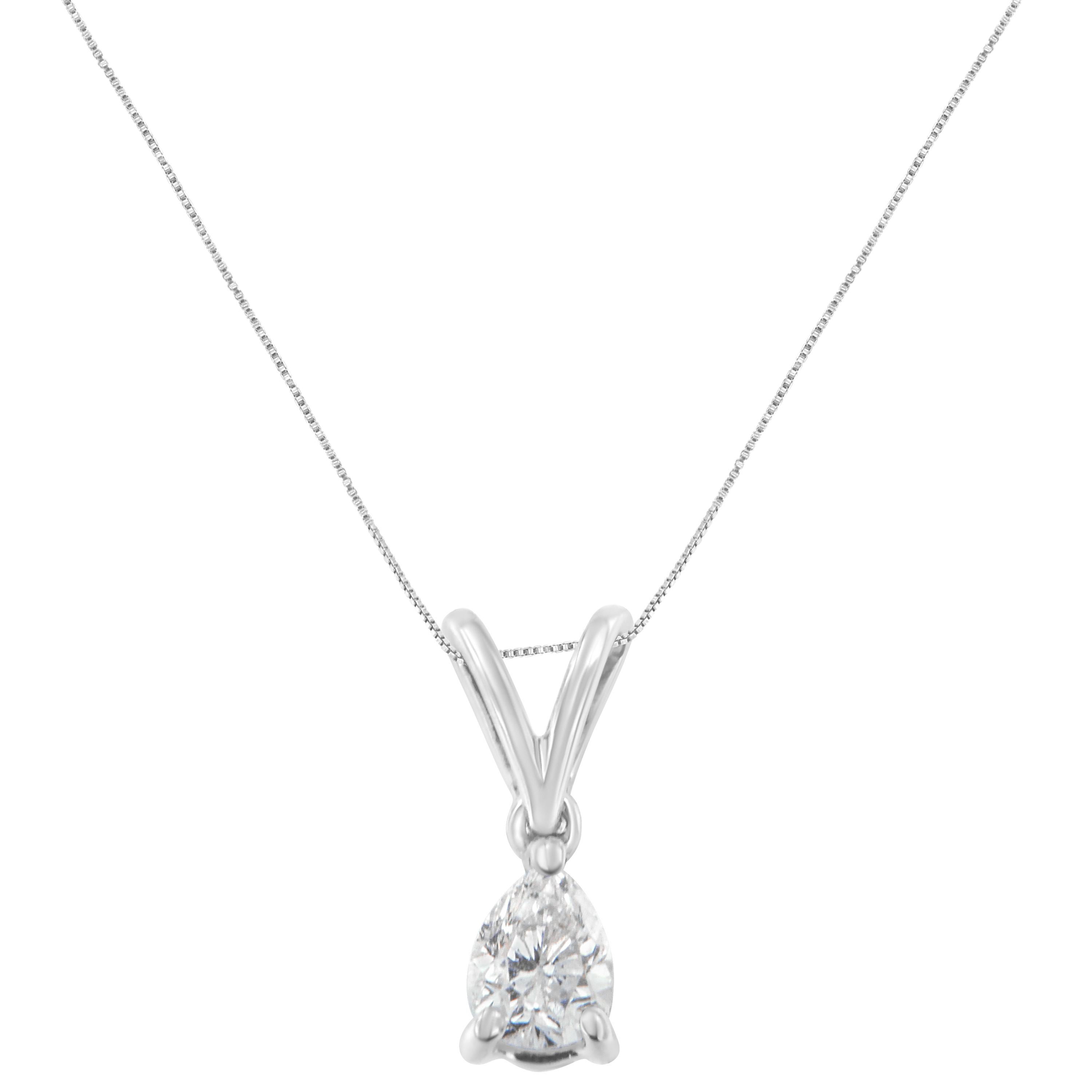 This classic design features a solitaire pear cut diamond hanging from a delicate chain. A timeless design to last a lifetime. It is crafted in 10 karat white gold and has a total diamond weight of 1/5 carats.

'Video Available Upon