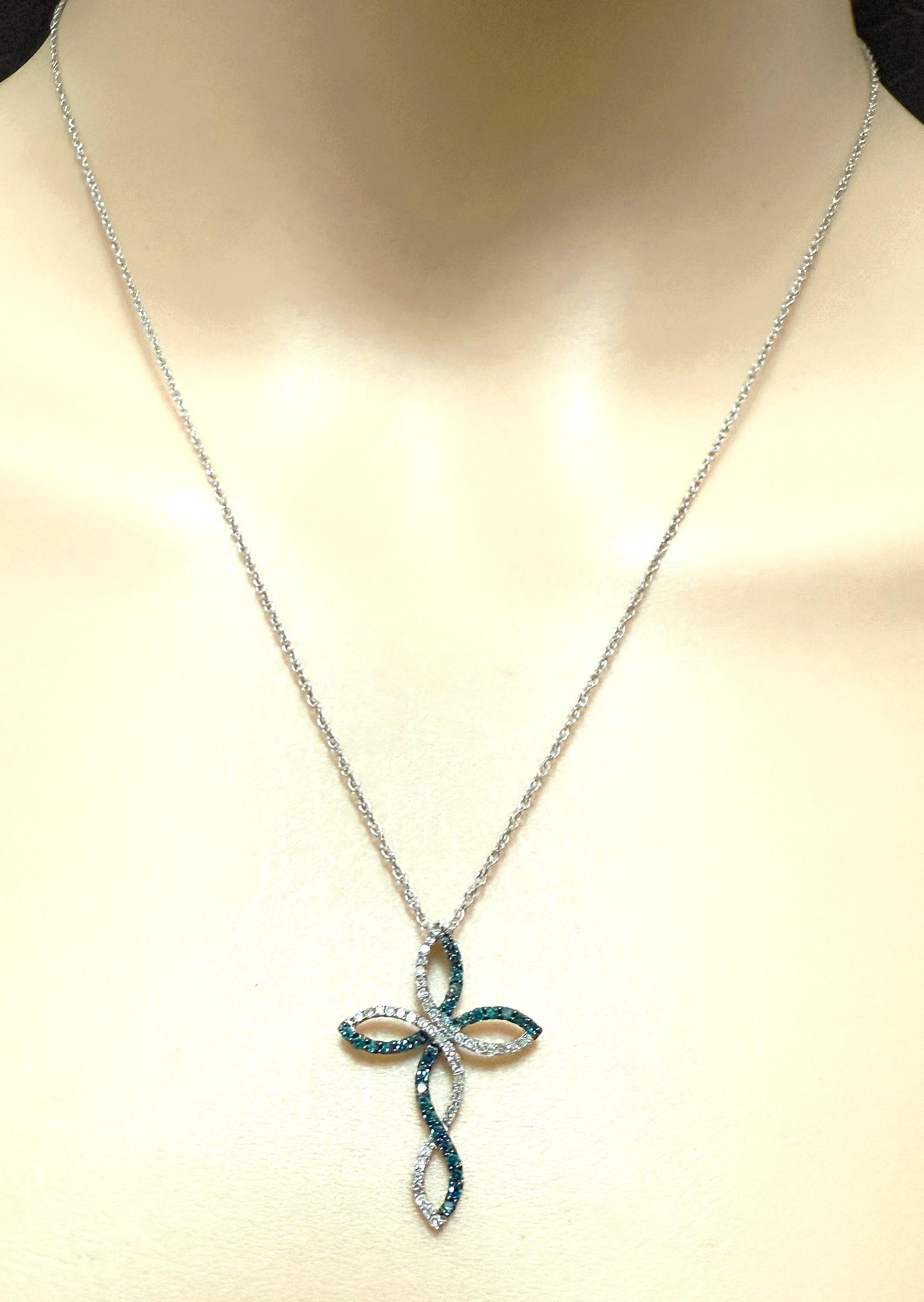 This pendant is really beautiful.  A great mix of .10 carats of White Diamonds and .10 carats of Deep Blue Sapphires.  The pendant itself is 1 inch long and .70 inches wide.  It is stamped 
