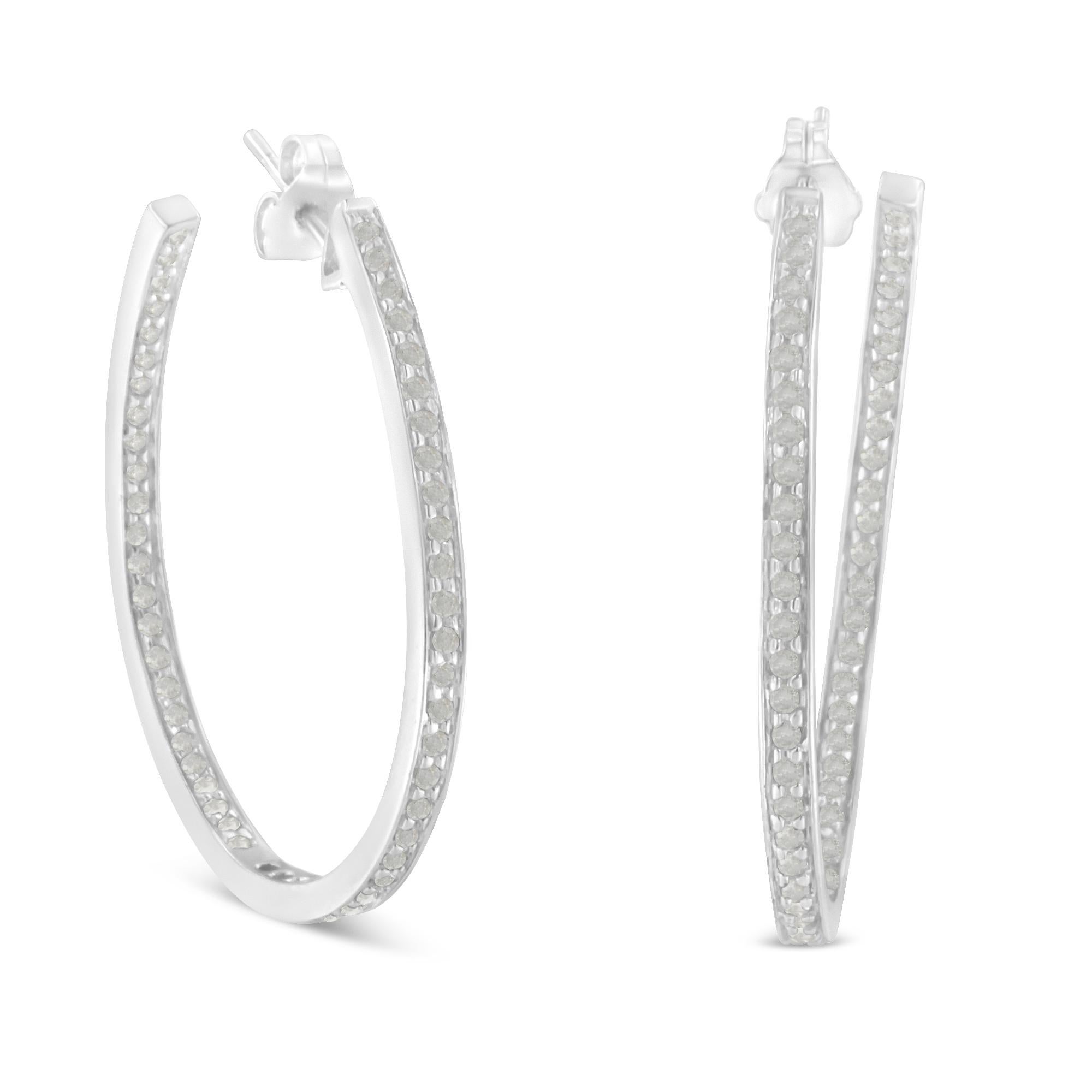 These glamorous 10k white gold hoop earrings showcase 1ct of round cut diamonds. The prong set diamonds inlay half the inside and outside of the hoops giving them maximum sparkle. These inside out hoop earrings are the perfect gift for that trendy,