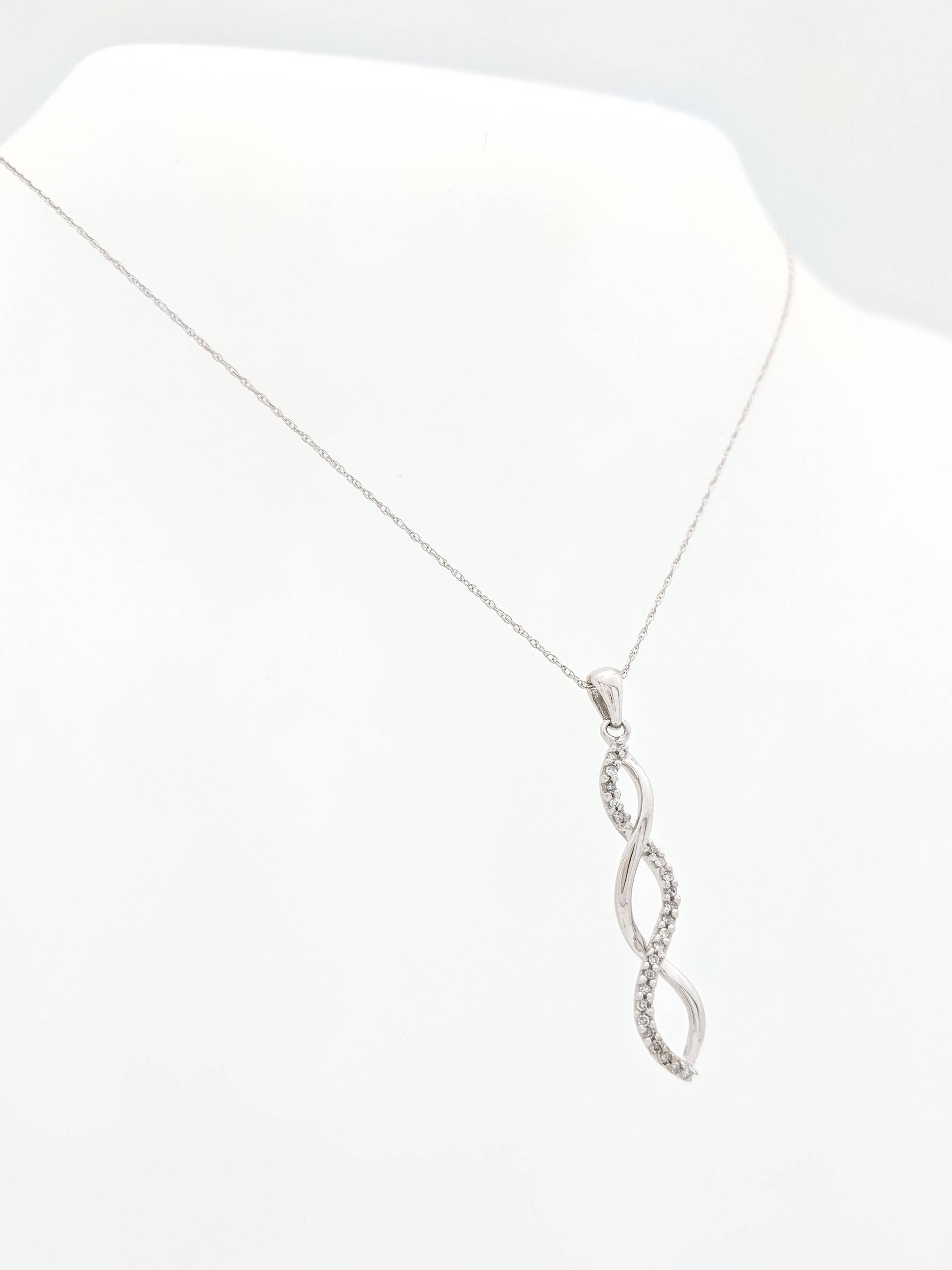 10k White Gold .25ctw Diamond Swirl Pendant Necklace 1.8 Grams

You are viewing a beautiful diamond swirl pendant necklace. This pendant necklace is crafted from 10k white gold and and weighs 1.8 grams. The pendant measures 1.5