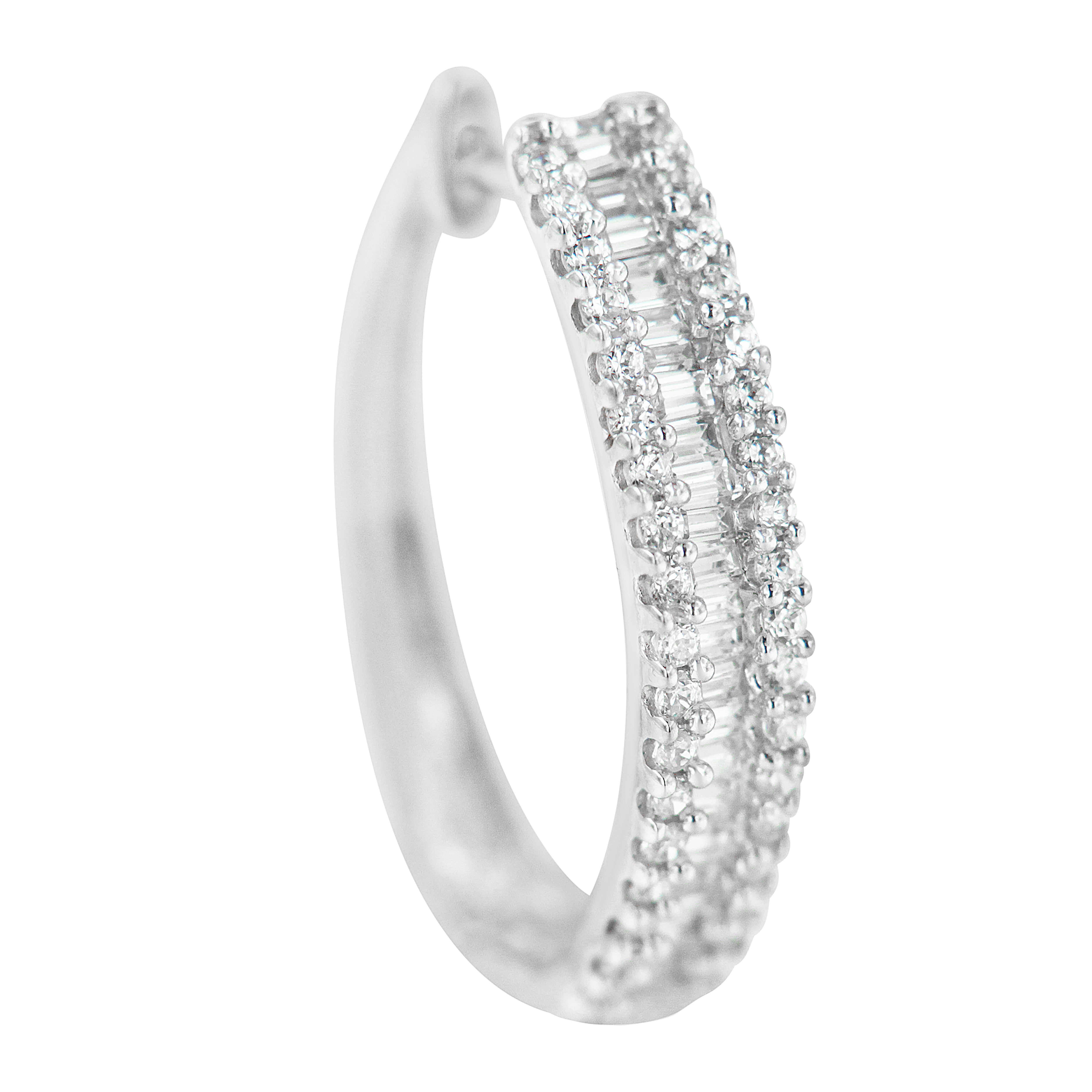 Three rows of diamonds add an eye catching sparkle to this classic hoop earring design. Fashioned in 10k white gold and with 3/4ct TDW of diamonds, these earrings are a great piece to have. A row of baguette cut diamonds runs down the middle and is