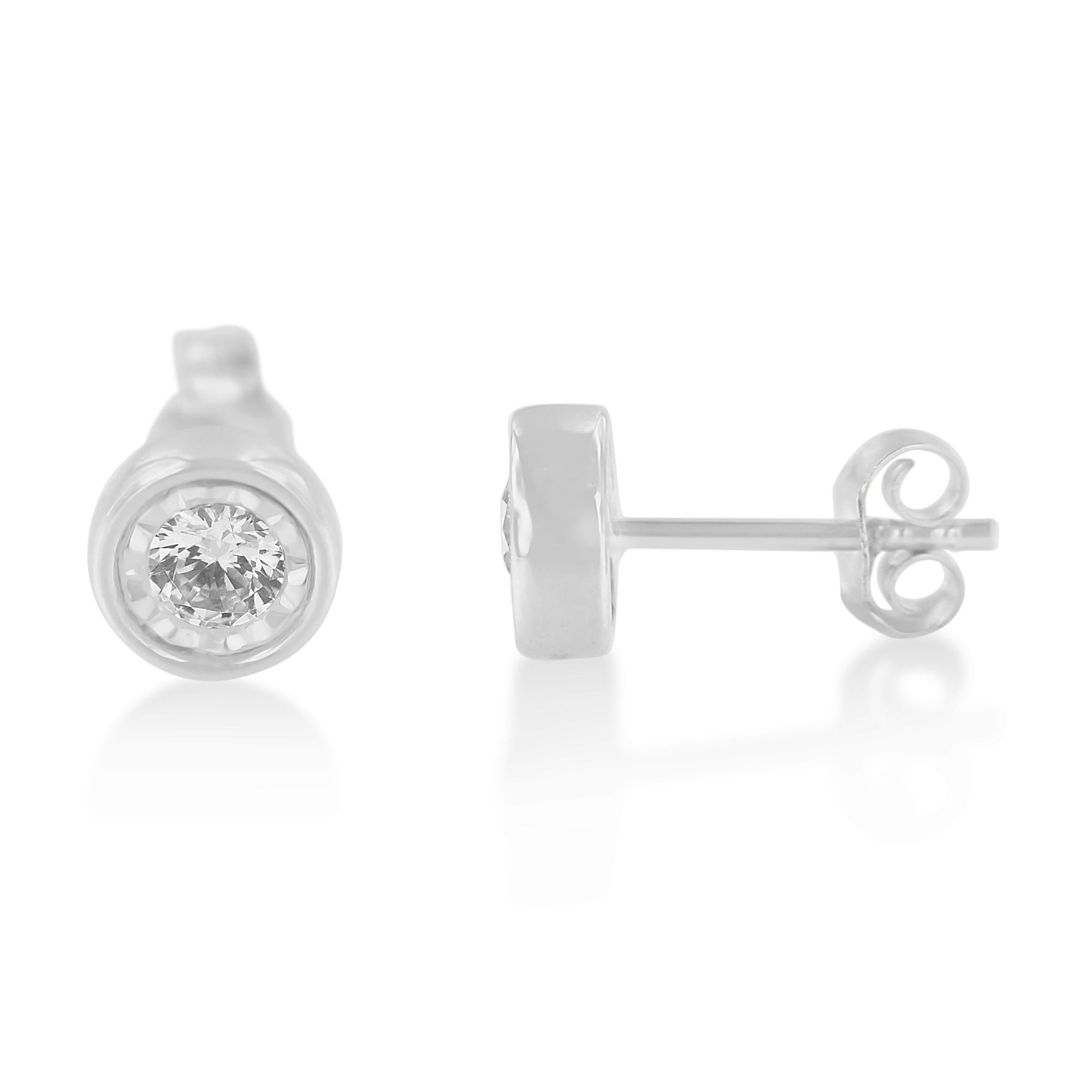 Add a touch of elegance to your everyday outfits with this stunning pair of diamond stud earrings. Made in a bezel design, this piece is made from the finest 10k white gold and is embellished with 2 round-cut diamonds in a miracle setting. The total
