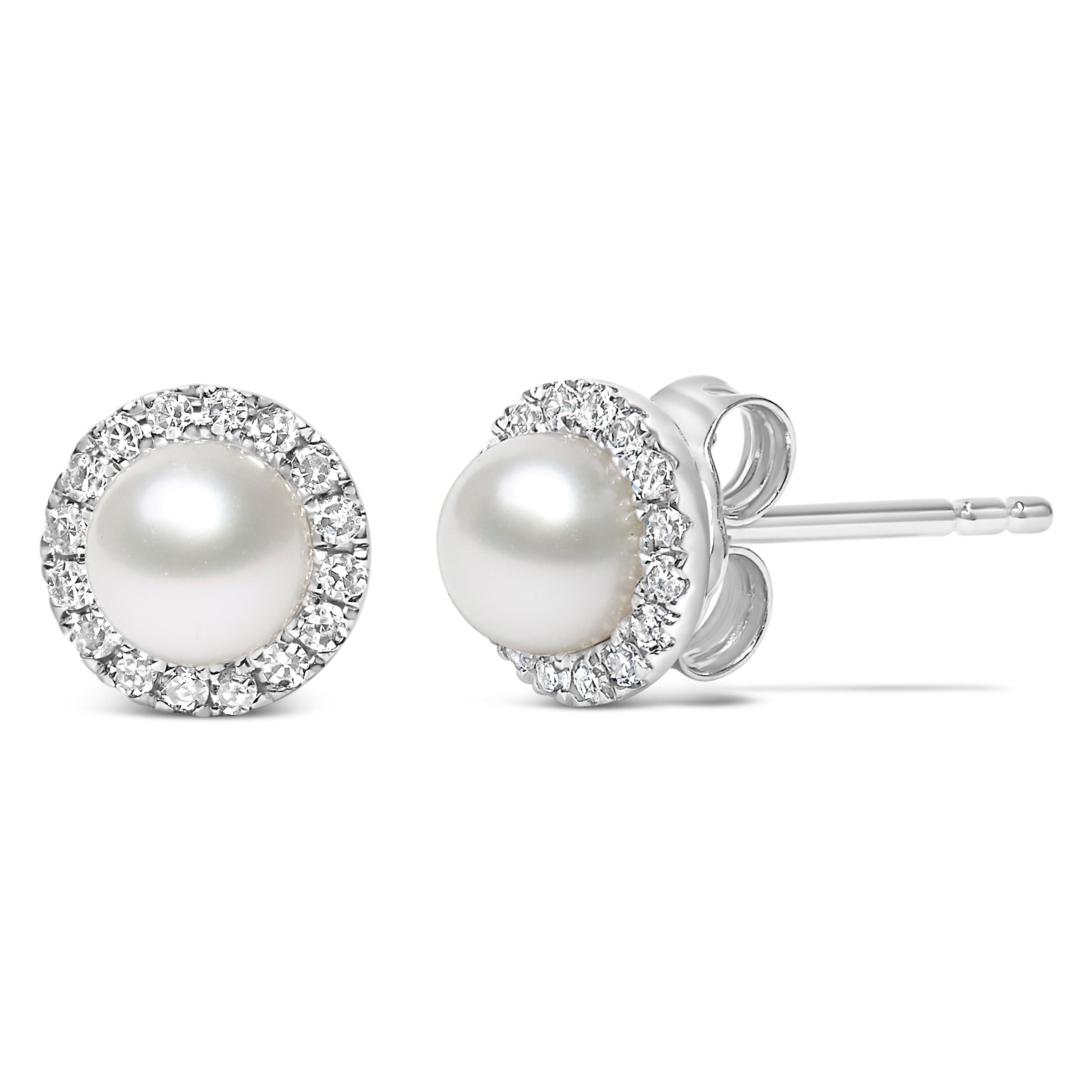 Discover the refined elegance encapsulated in these delicately crafted earrings, featuring 4.5mm cultured Chinese freshwater pearls nestled in a shimmering halo of natural white diamonds. Each lustrous pearl, a whisper of timeless sophistication, is