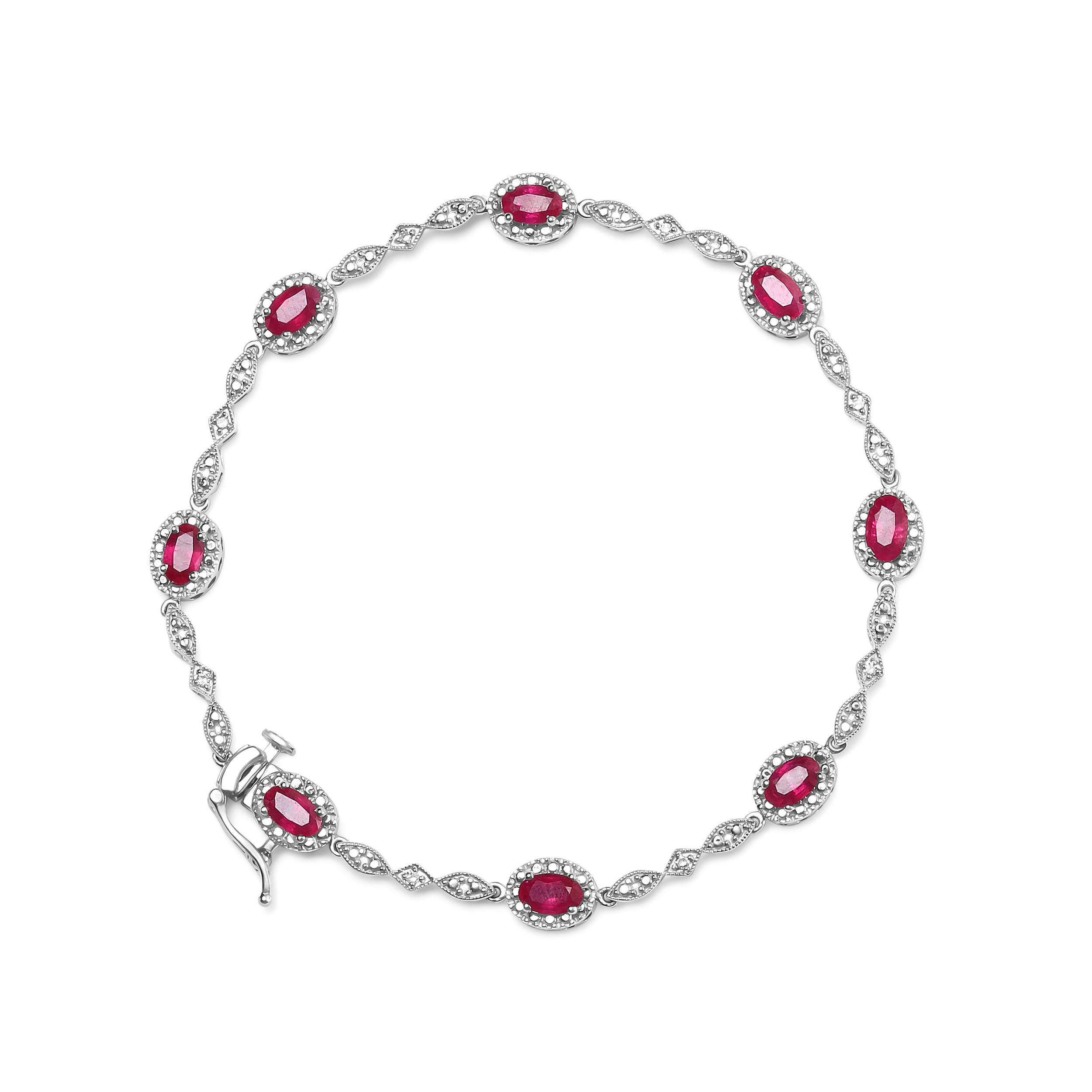 Behold this stunning link bracelet, fit for a queen. Crafted from lustrous 10K white gold, it features eight natural heat treated red rubies, each elegantly cut into an oval shape measuring 4.5mm x 3mm. The rubies are perfectly complemented by eight