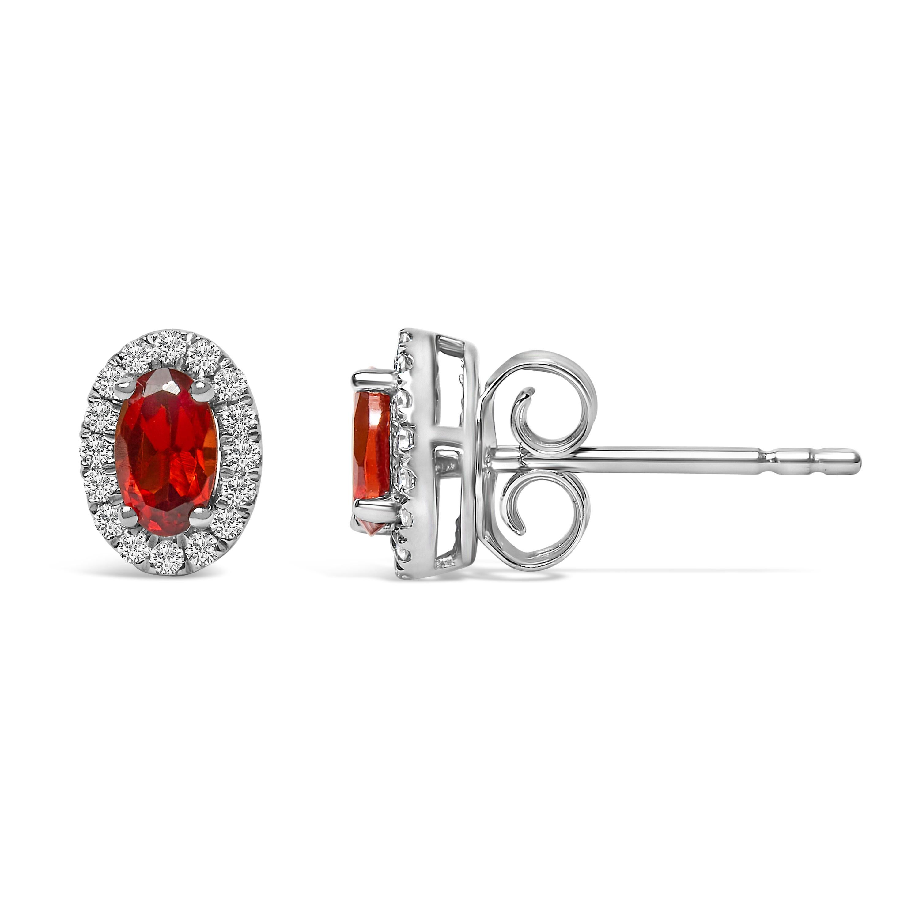 Modern 10K White Gold 5x3 MM Oval Red Garnet and Diamond Halo Stud Earrings For Sale