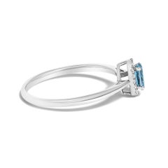 10K White Gold 5X3MM Oval Blue Topaz and Diamond Accent Halo Ring