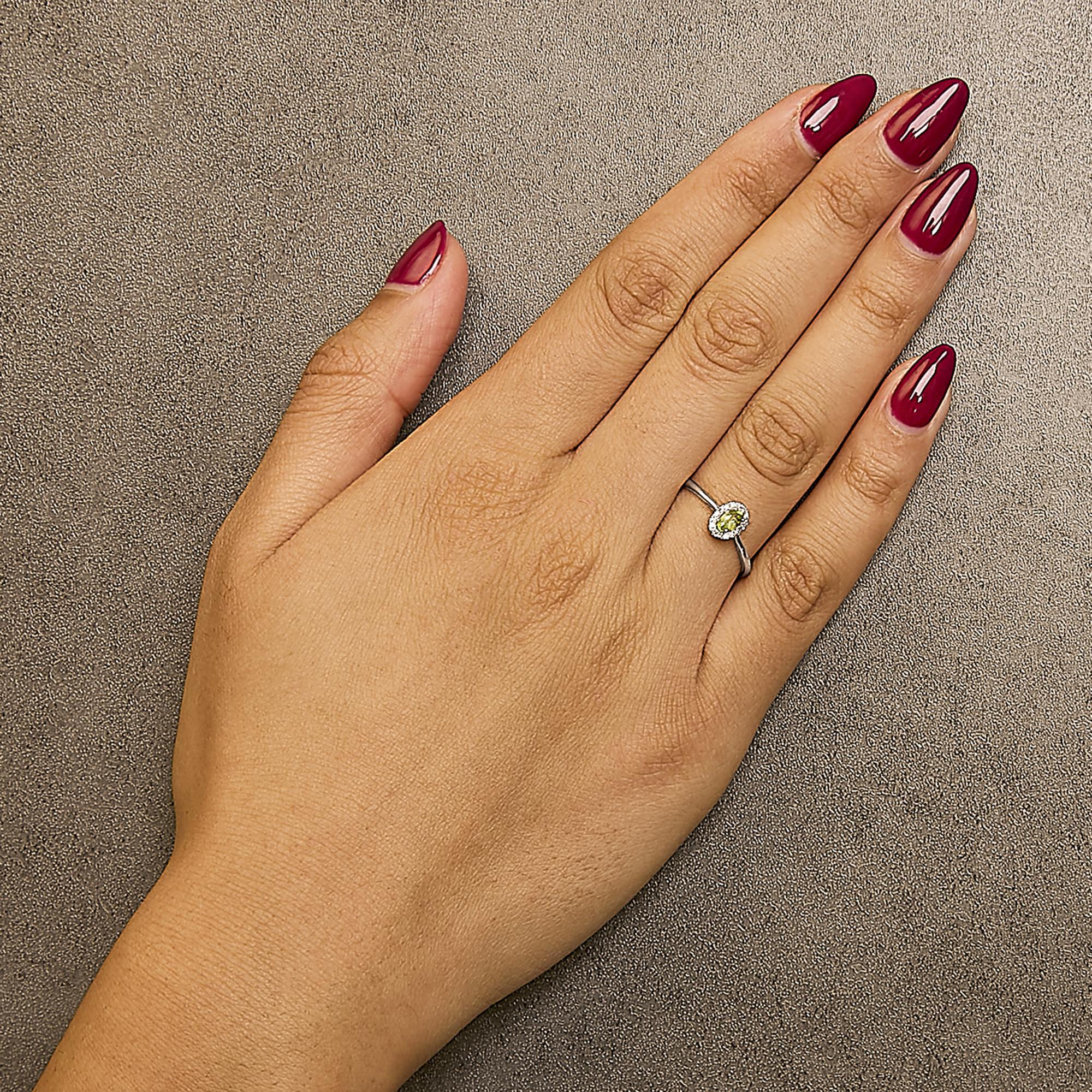 10K White Gold 5X3MM Oval Green Peridot and Diamond Accent Halo Ring In New Condition For Sale In New York, NY