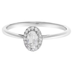 10K White Gold 5X3MM Oval White Topaz and Diamond Accent Halo Ring