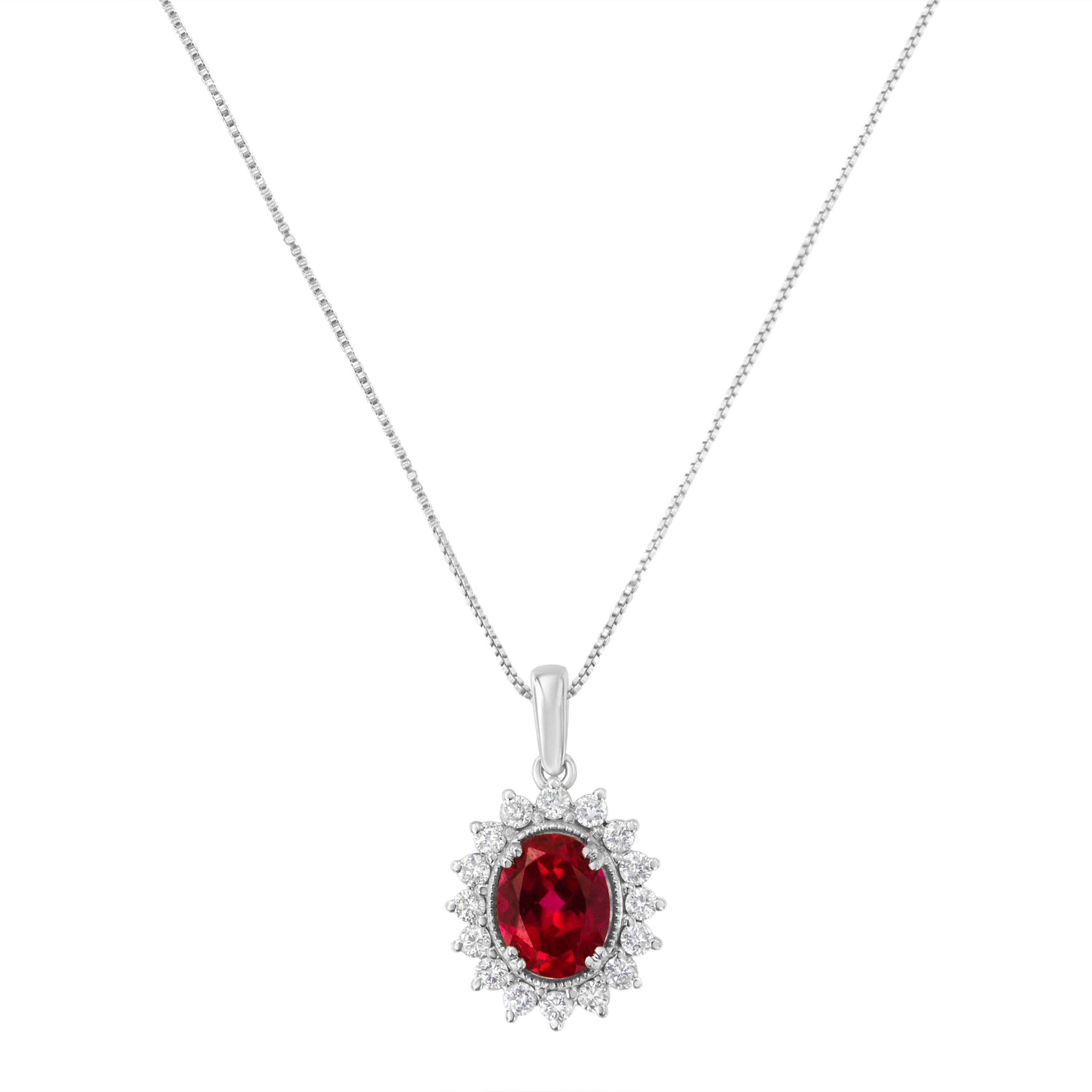 A delicate box chain holds a breathtaking oval ruby halo pendant. The dazzling 9MM oval cut red ruby gemstone is enhanced by a halo of 1/2ct round cut diamonds. The exquisite design is crafted in 10k white gold.

Product Features:

Diamond Type: