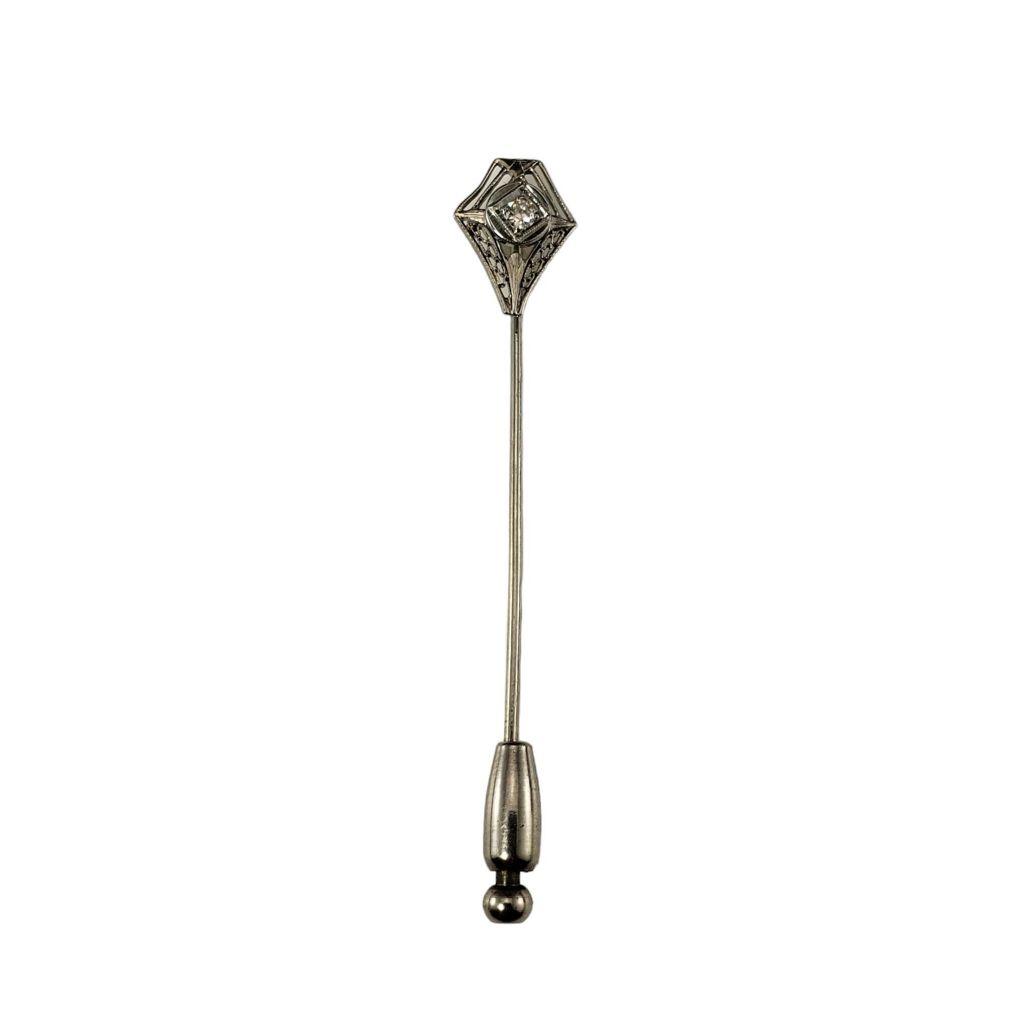 Vintage 10K White Gold and Diamond Stick Pin-

This elegant pin features one round old mine cut diamond set in classic 10K white gold.

Approximate total diamond weight: .06 ct.

Diamond color: H

Diamond clarity: SI1

Size: 2.4 inches x 10