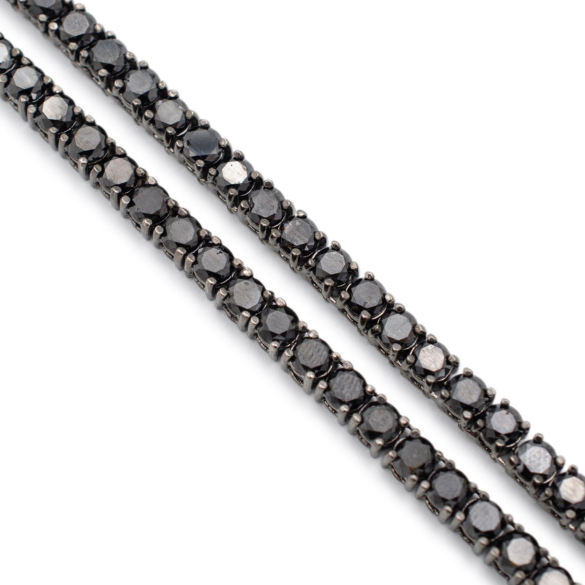 Gender: Unisex

Metal Type: 10K White Gold & Black Rhodium

Length: 44.00 Inches

Width: 5.30 mm

Weight: 111.04 grams

Black rhodium plated 10K white gold single strand rope diamond necklace. The metal was tested and determined to be 10K white