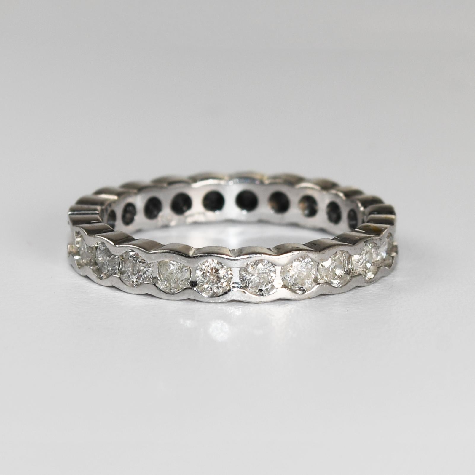 Ladies diamond band in 10k white gold.
Stamped 10k and weighs 2.2 grams.
There are 1.00 total carats of round brilliant cut diamonds.
Half of them are black diamonds, .50 carats. The others are .50 carats of h to i color, si2 to i1 clarity.
You can