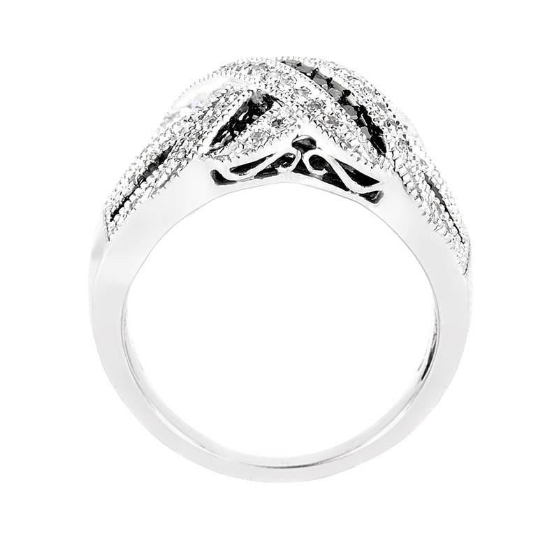 This band ring is gorgeous and shimmers with diamonds. It is made of 10K white gold and boasts a design that features ~.50ct of black and white diamonds.

