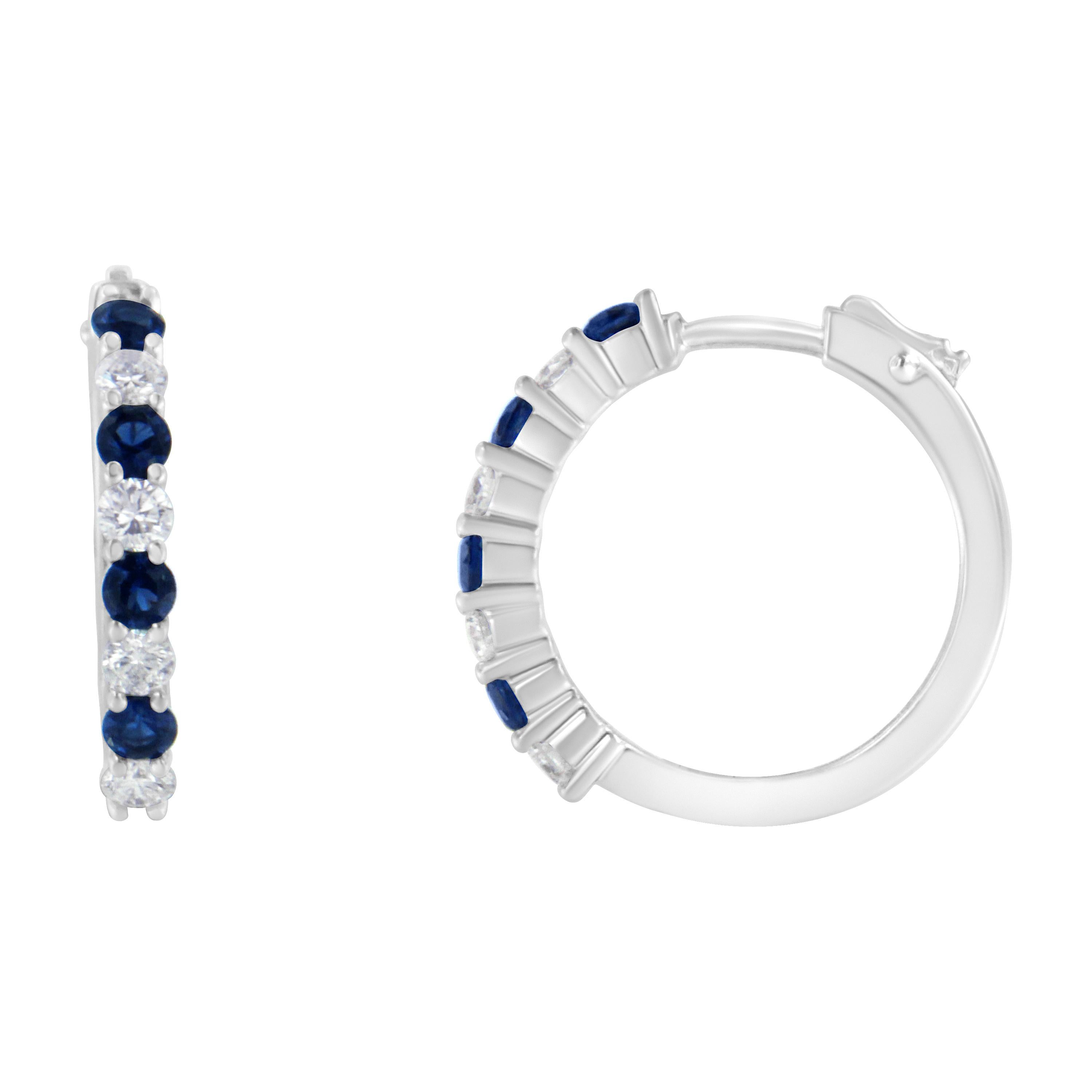 Elegant and classic, these stunning hoop earrings are fashioned in 10k white gold. Sparkling 1/2ct TDW of round cut diamonds alternate with 2.5MM, lab created, round blue sapphires and inlay the front of the hoop. A lever back mechanism keeps the