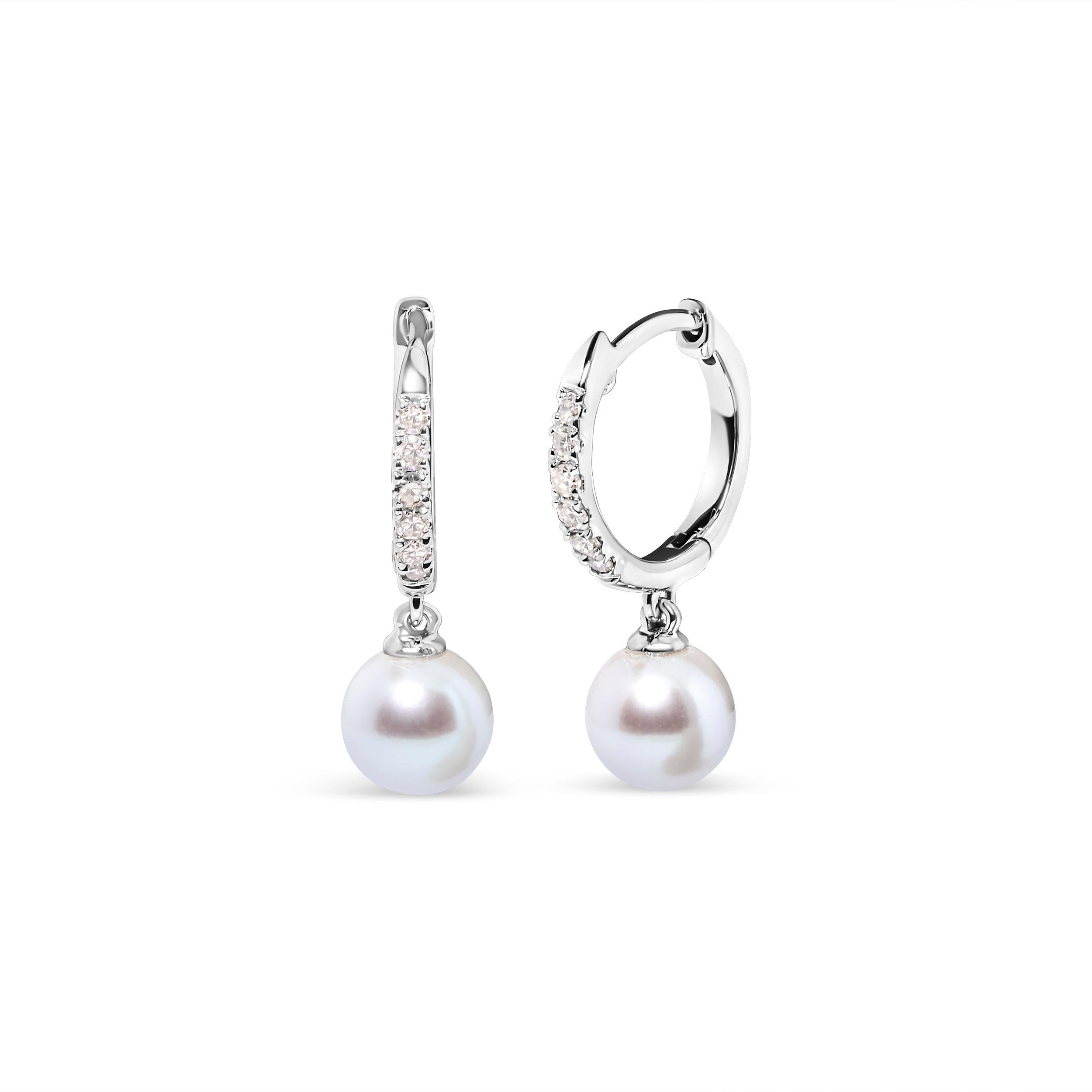 Introducing a captivating masterpiece for women who seek elegance and sophistication. These exquisite pearl drop earrings feature a dazzling array of 12 round diamonds accented. The diamonds, sourced from nature, boast a brilliant H-I color and are