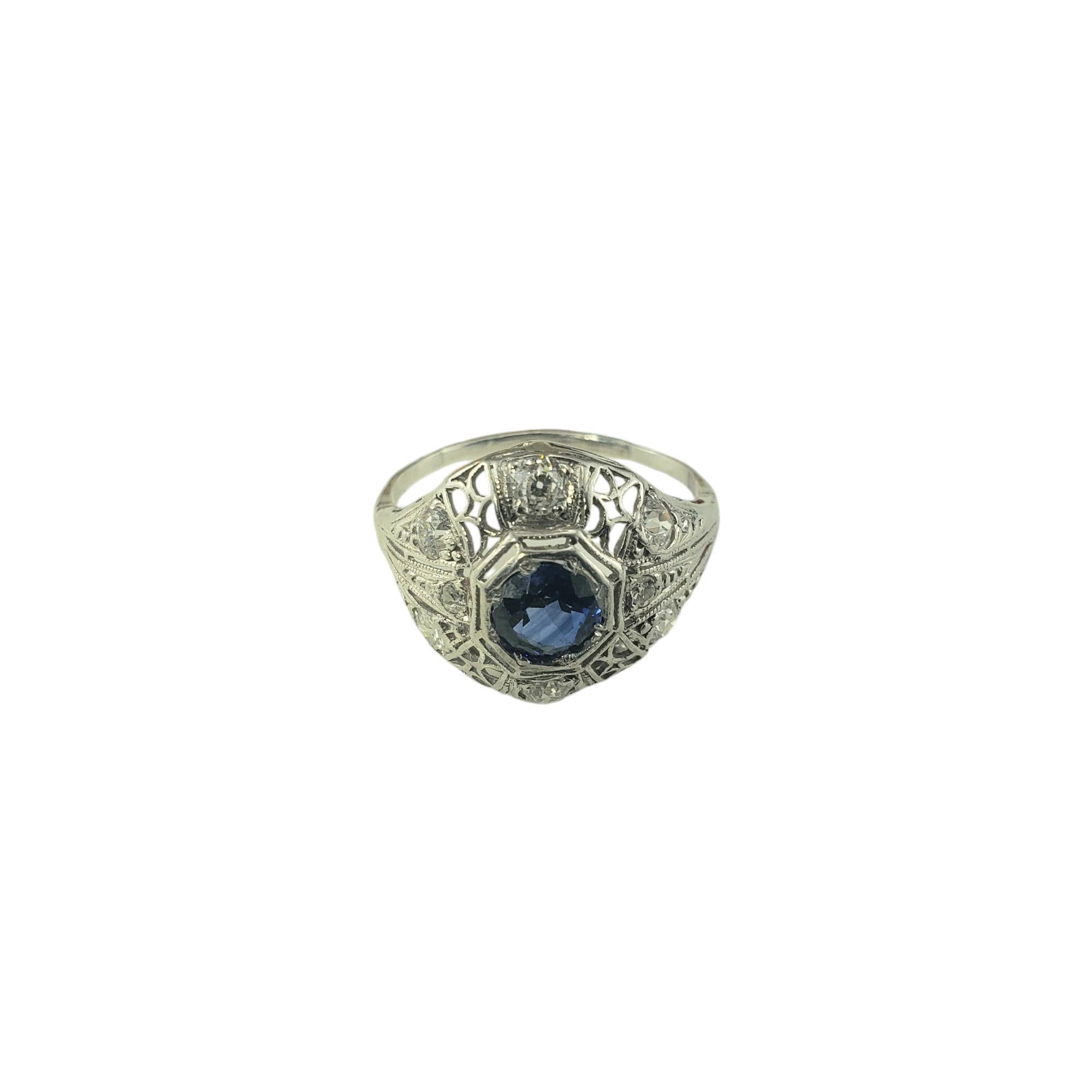 10 Karat White Gold Filigree and Diamond Ring Size 7 JAGi Certified-

This stunning ring features one round sapphire, six brilliant cut diamonds and two old European single cut diamonds set in beautifully detailed 10K white gold filigree.

Width: 14