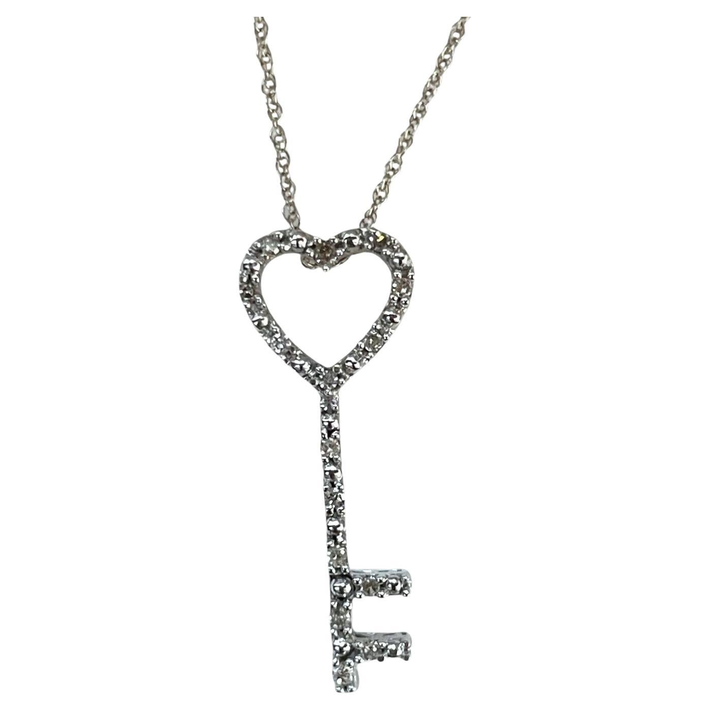 10K White Gold Heart-Key Pendant with Sparkling Diamonds