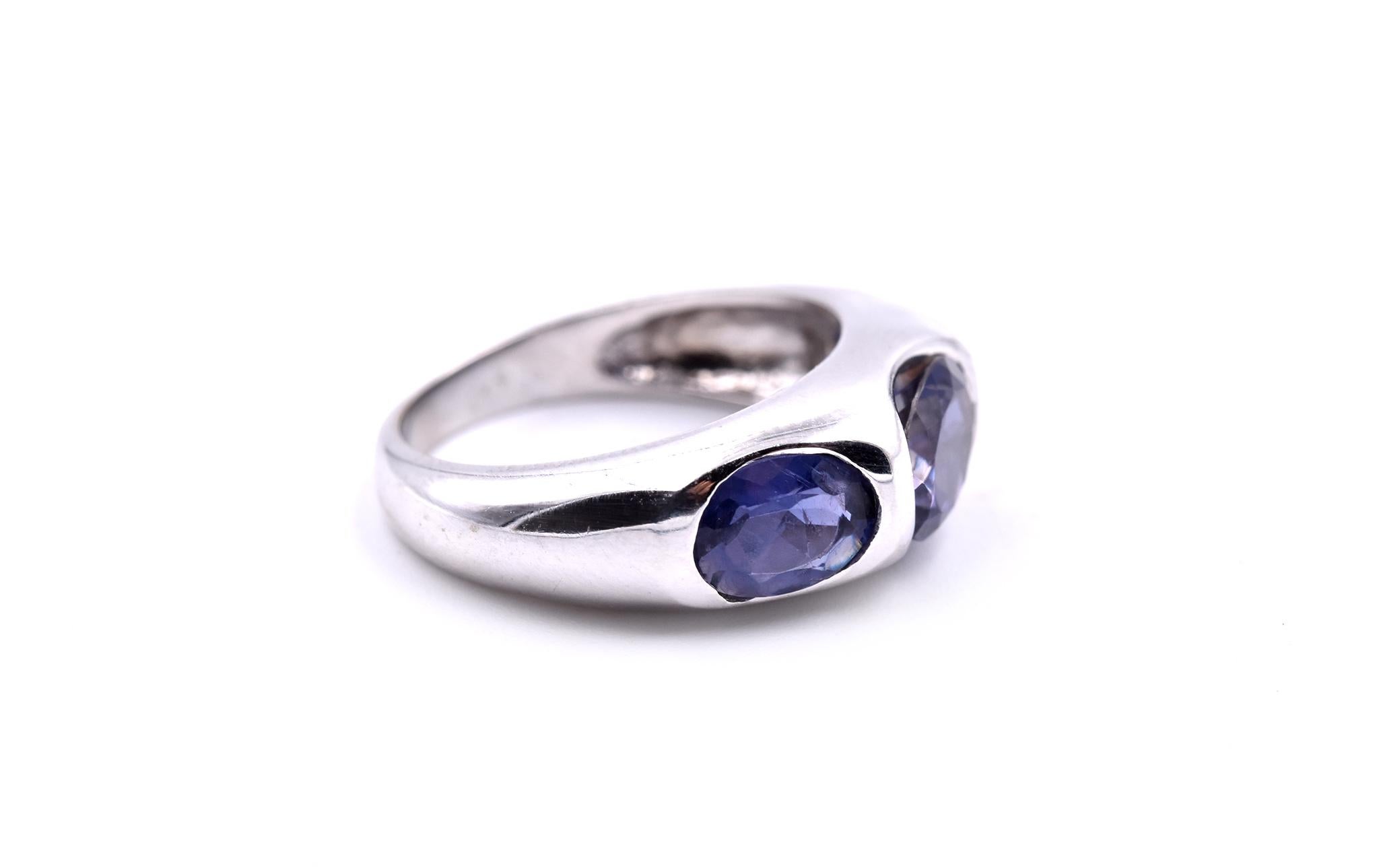 Designer: custom design
Material: 10k white gold
Stones: 3 oval cut iolite
Size: 5 ¾ (please allow two additional shipping days for sizing requests)
Dimensions: ring top is 7.20 wide 
Weight: 4.65 grams
