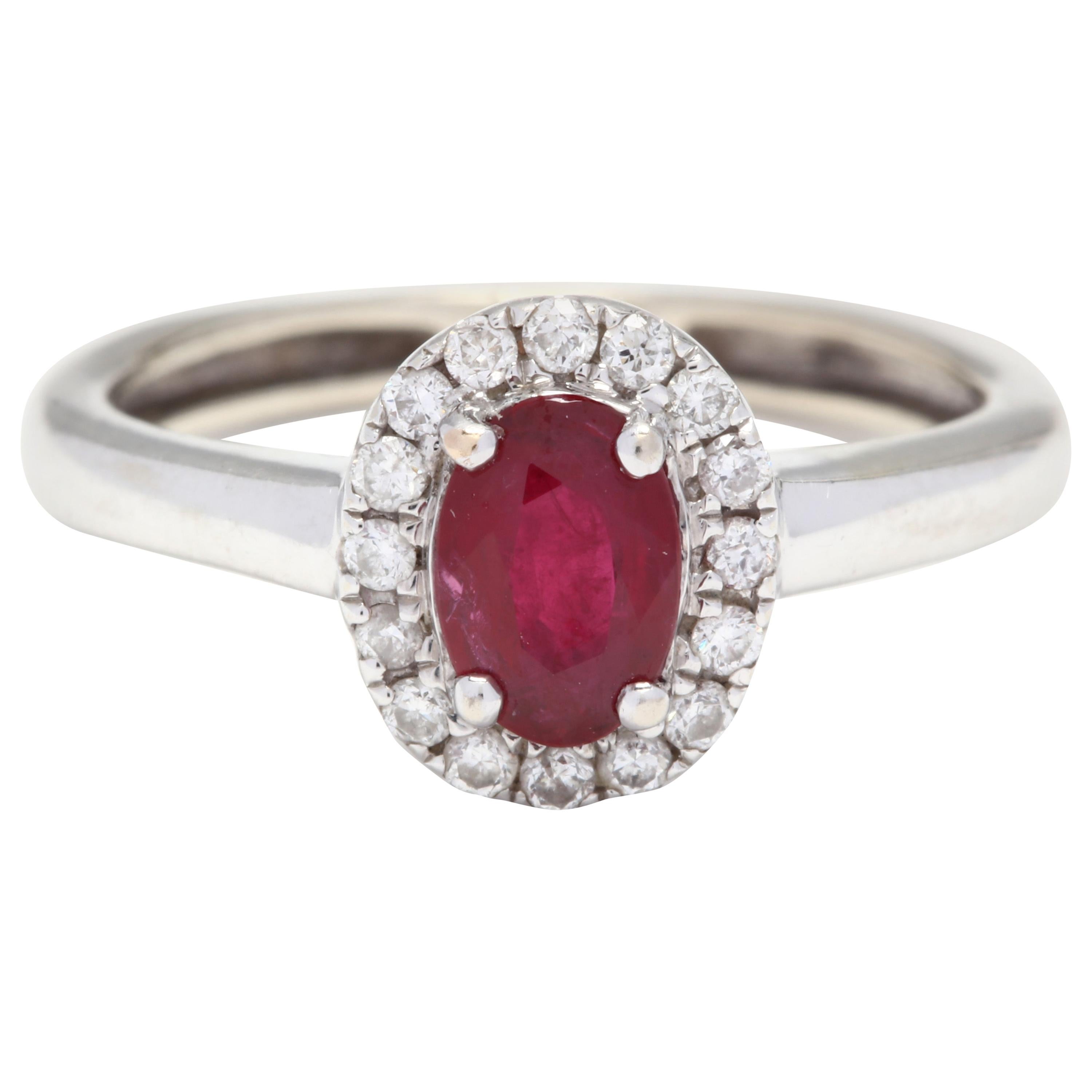 10 Karat White Gold Oval Ruby and Diamond Halo Ring