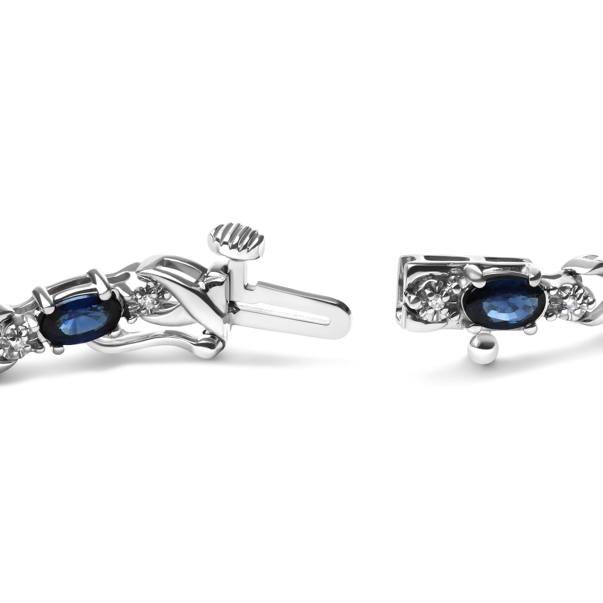 Indulge in the captivating allure of our exquisite bracelet, perfect for the elegant and sophisticated woman. A natural heat-treated blue sapphire, with a stunning oval shape and measuring 5 x 4mm, is prong set amidst 22 natural round diamonds