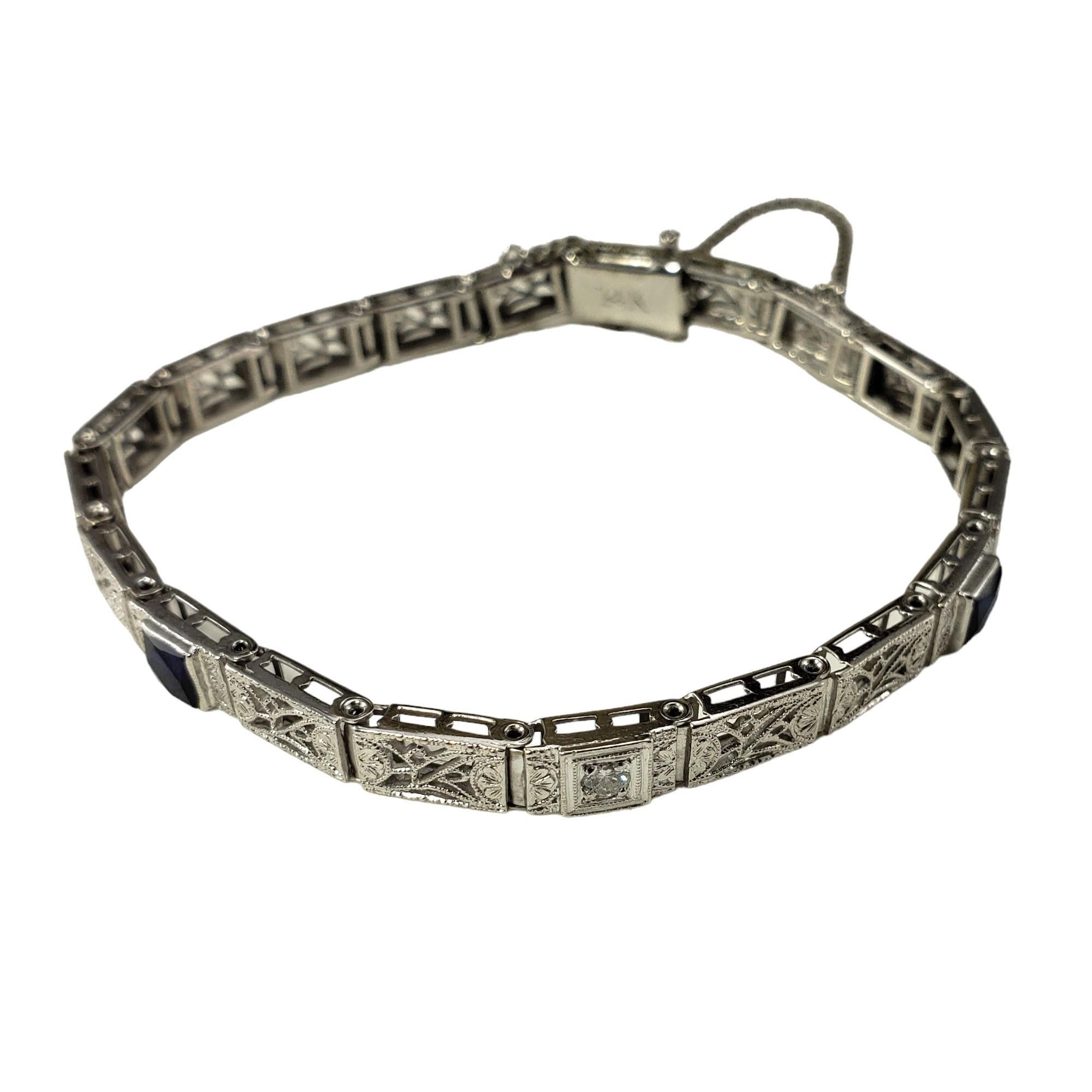 10K White Gold and Platinum Filigree Synthetic Sapphire and Diamond Bracelet

This lovely bracelet features two blue synthetic sapphire stones and one round brilliant cut diamond set in beautifully detailed 10K white gold and platinum filigree.  

1