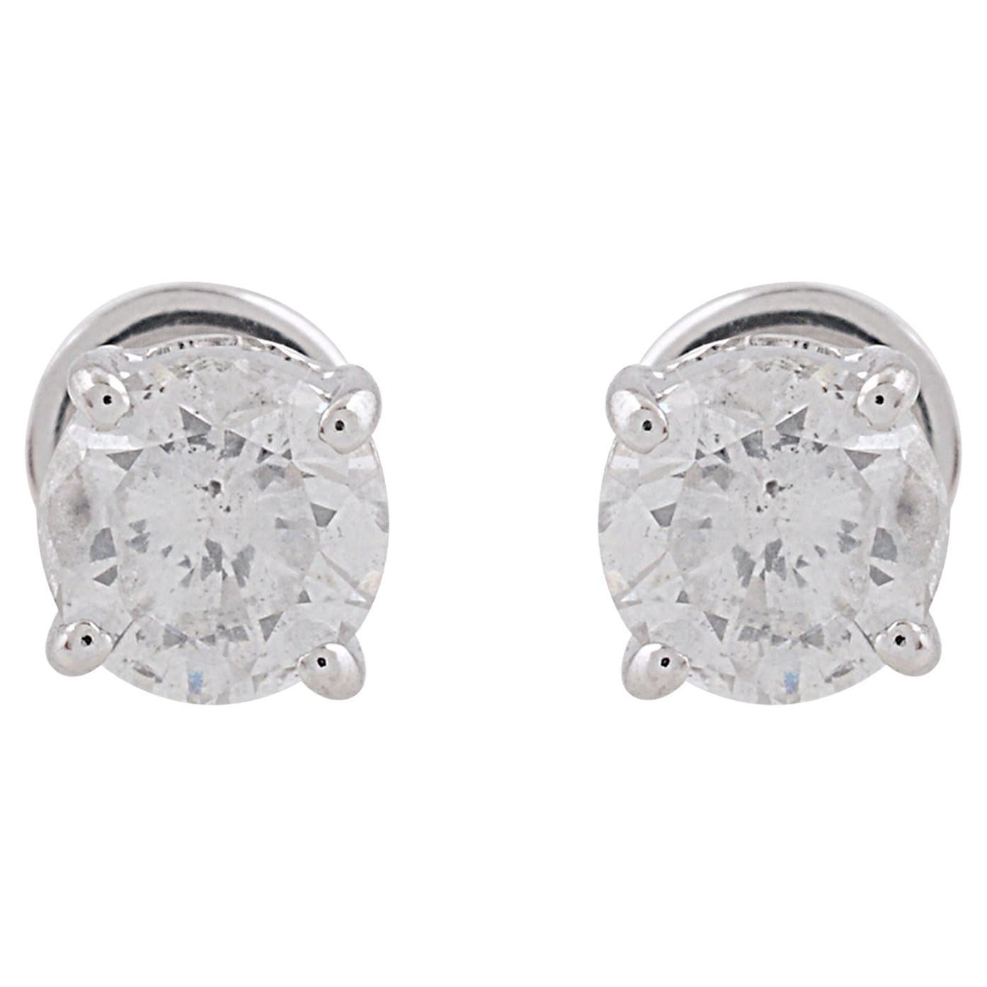 Set in solid 10k white gold, the minimalist design of these earrings allows the diamonds to take center stage, while the sleek and polished setting adds a touch of modern sophistication. The simplicity of the design ensures versatility, making these