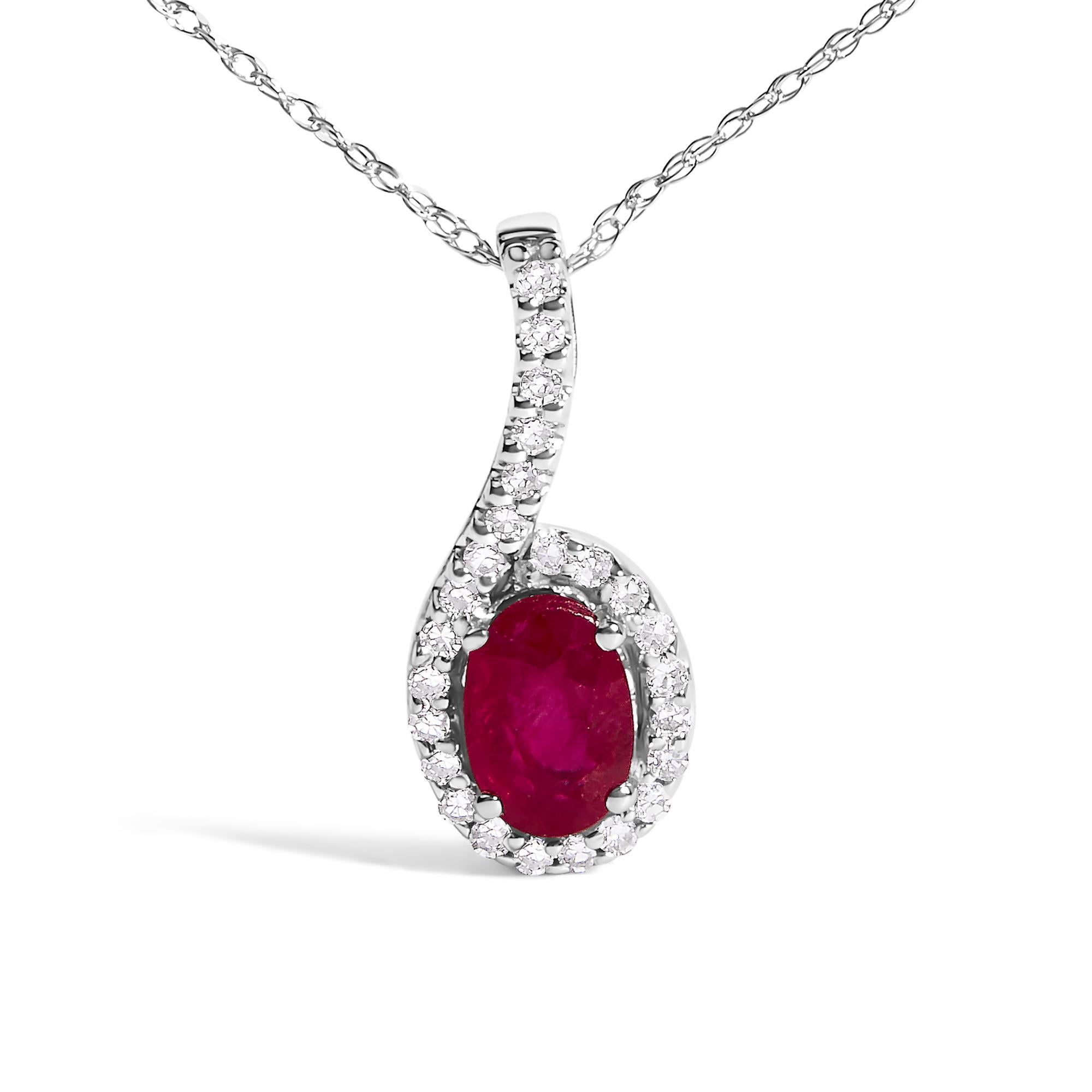 Discover elegance encapsulated within the 10K White Gold Red Ruby and Diamond Accent Teardrop Pendant Necklace. Crafted with meticulous precision, this rhodium-plated treasure features a mesmerizing 4x6mm oval-cut, heat-treated natural red ruby