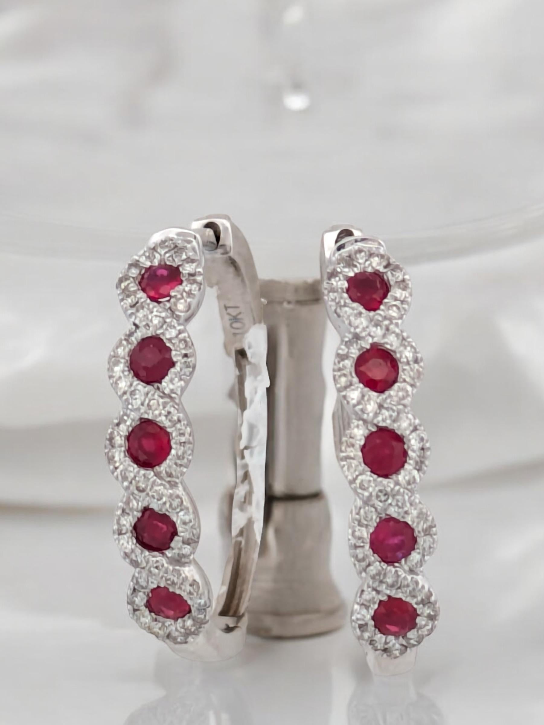 These elegant 10K white gold earrings showcase the vibrant beauty of .45 CTW natural Rubies, complemented by .33 CTW natural Diamonds for the perfect touch of brilliance. Crafted for timeless sophistication, these earrings are ideal for both