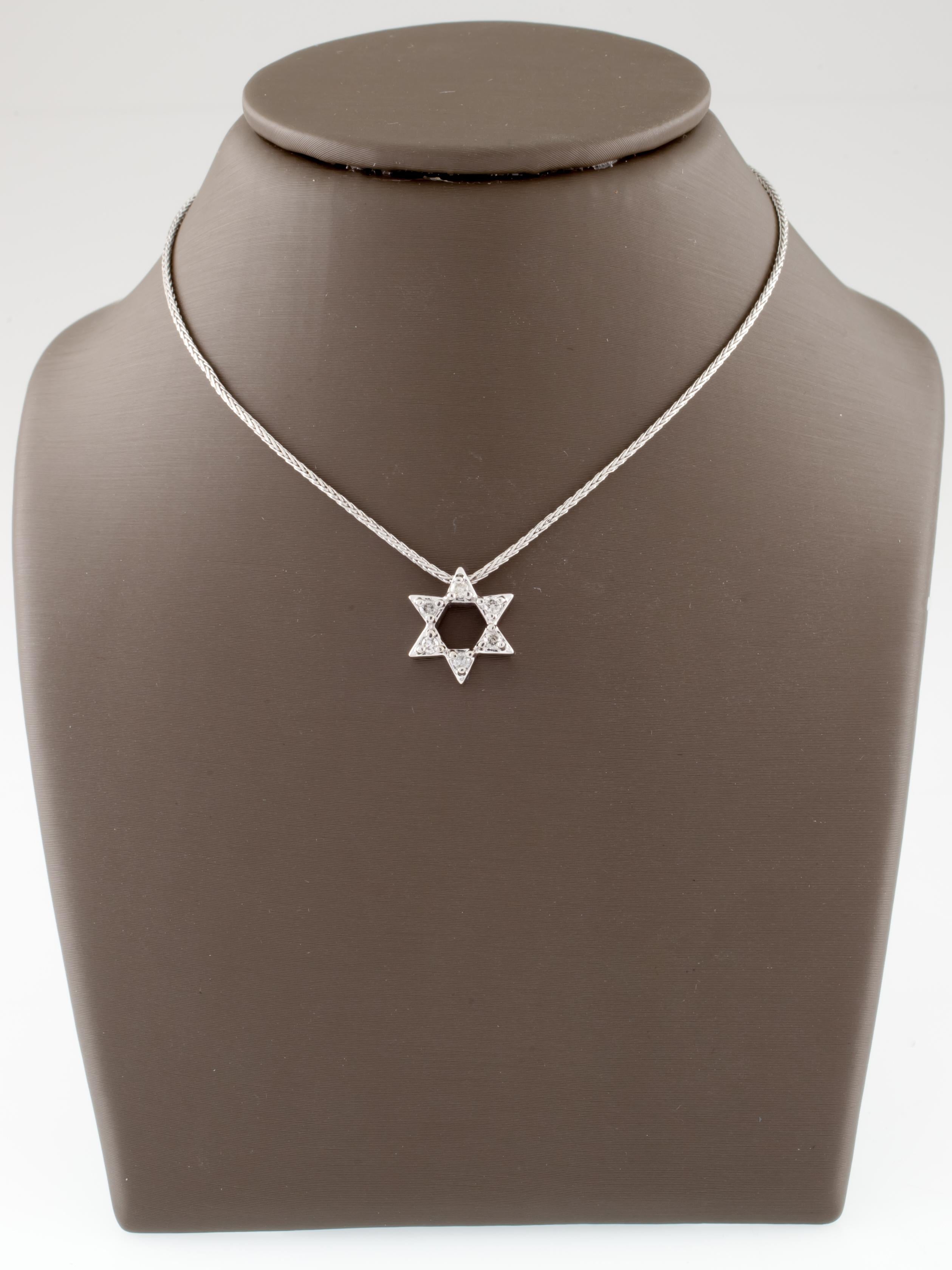 Gorgeous 10k White Gold Star of David Pendant
Each Star Arm Contains one Round Diamond
Total Diamond Weight = 0.15 ct
Average Color = H - I
Average Clarity = SI
Pendant is 11 mm in diameter
Includes 16