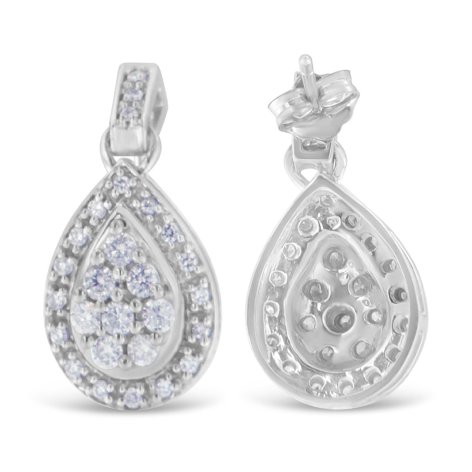 Add some shine and sparkle to your gorgeous look with this pair of dazzling earrings. Fashioned in a teardrop shape, the earrings are crafted from precious 10 karat white gold. Each of the pieces is ornamented with a flickering round cut diamonds