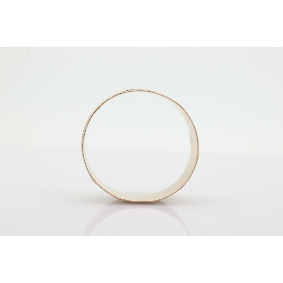 Vintage from the 1910s
Size: 6 3/4 US
Materials: Gold
Band color: Rose gold
Adjustable

Style: Art deco

Beautiful Antique 10k 6mm wide wedding/cigar band. These are getting harder to come by. Can be used as a stackable ring.

Condition: has tiny