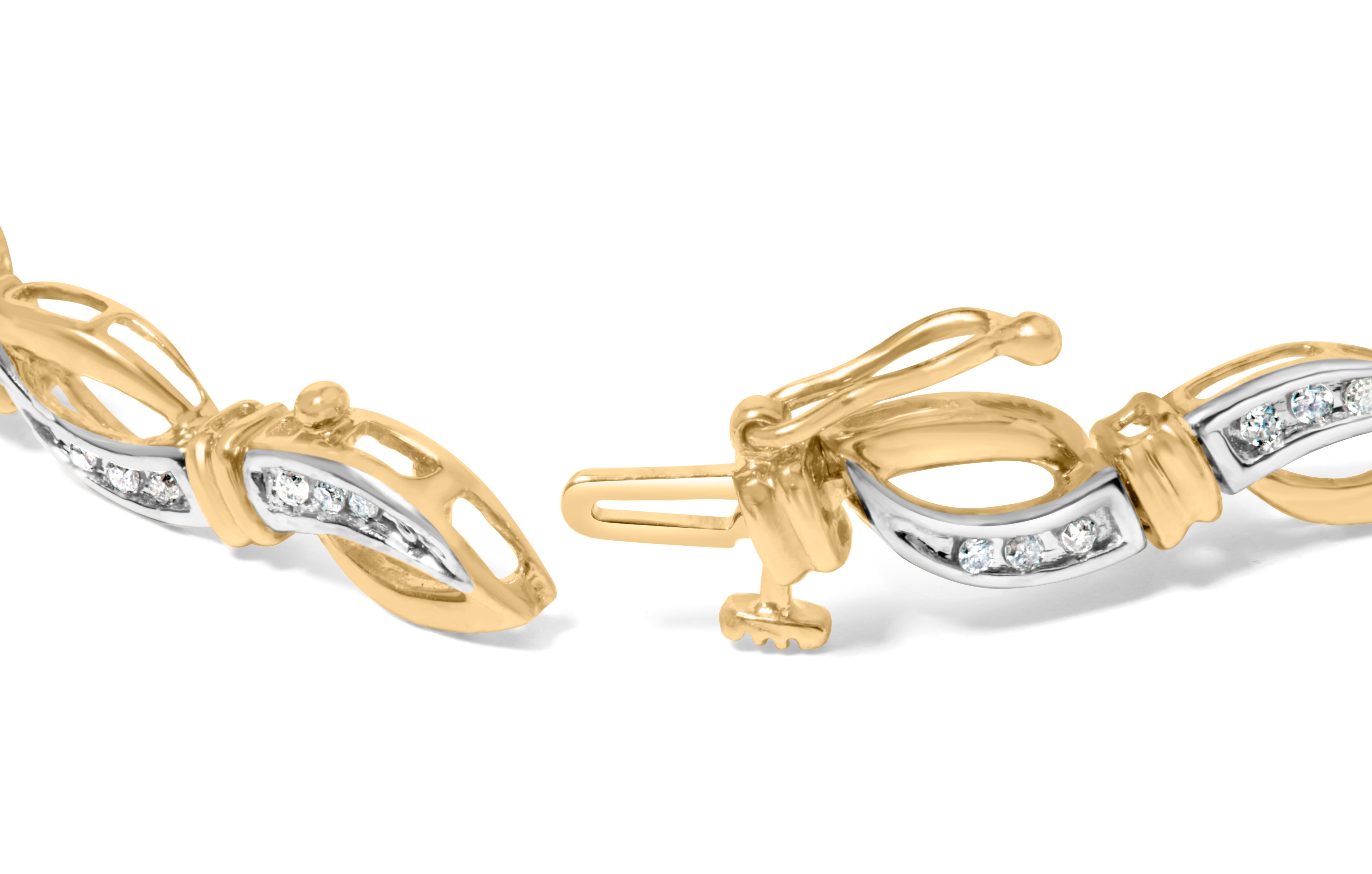 Adorn your wrist with timeless elegance and grace, courtesy of this exquisite round-cut diamond link bracelet. Crafted from 10K yellow and white gold, it exudes a warm and radiant glow that perfectly complements the brilliance of the 42 round-cut
