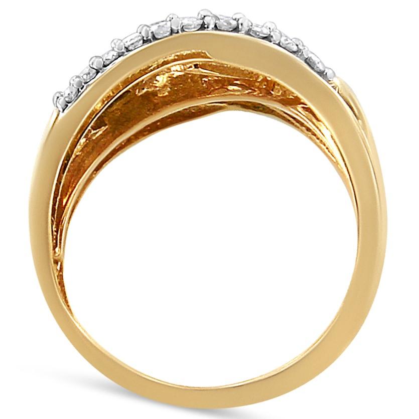 Intricately designed, this bold cocktail ring has a band woven together with sparkling 10k yellow gold to create an eye-catching cross bypass look. The yellow gold is embellished with natural round and baguette-cut diamonds. The stones are
