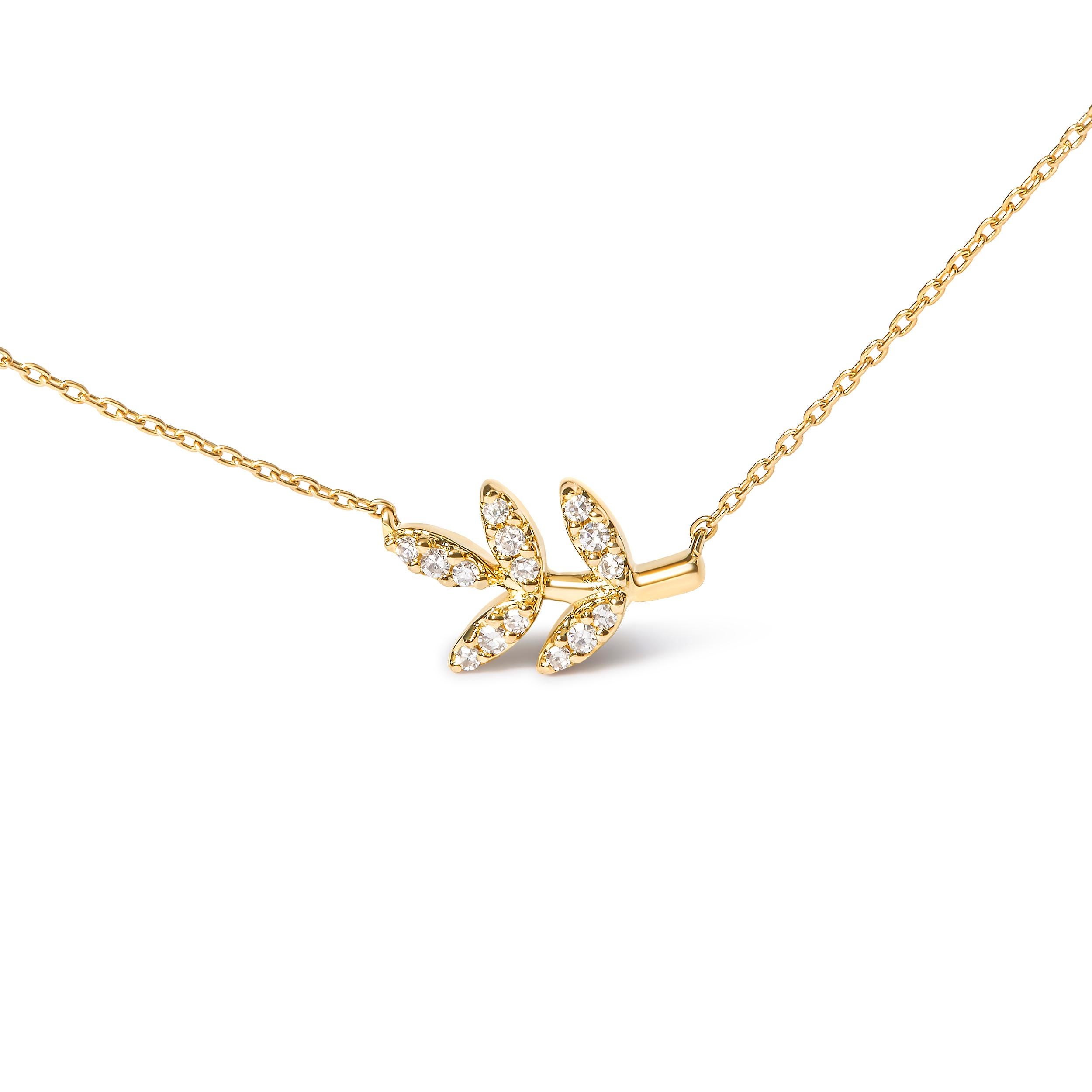 Introducing a mesmerizing masterpiece that will leave you captivated. Crafted in 10K yellow gold, this enchanting pendant necklace features a stunning leaf and branch design, symbolizing growth and harmony. Adorned with 15 round diamonds, totaling