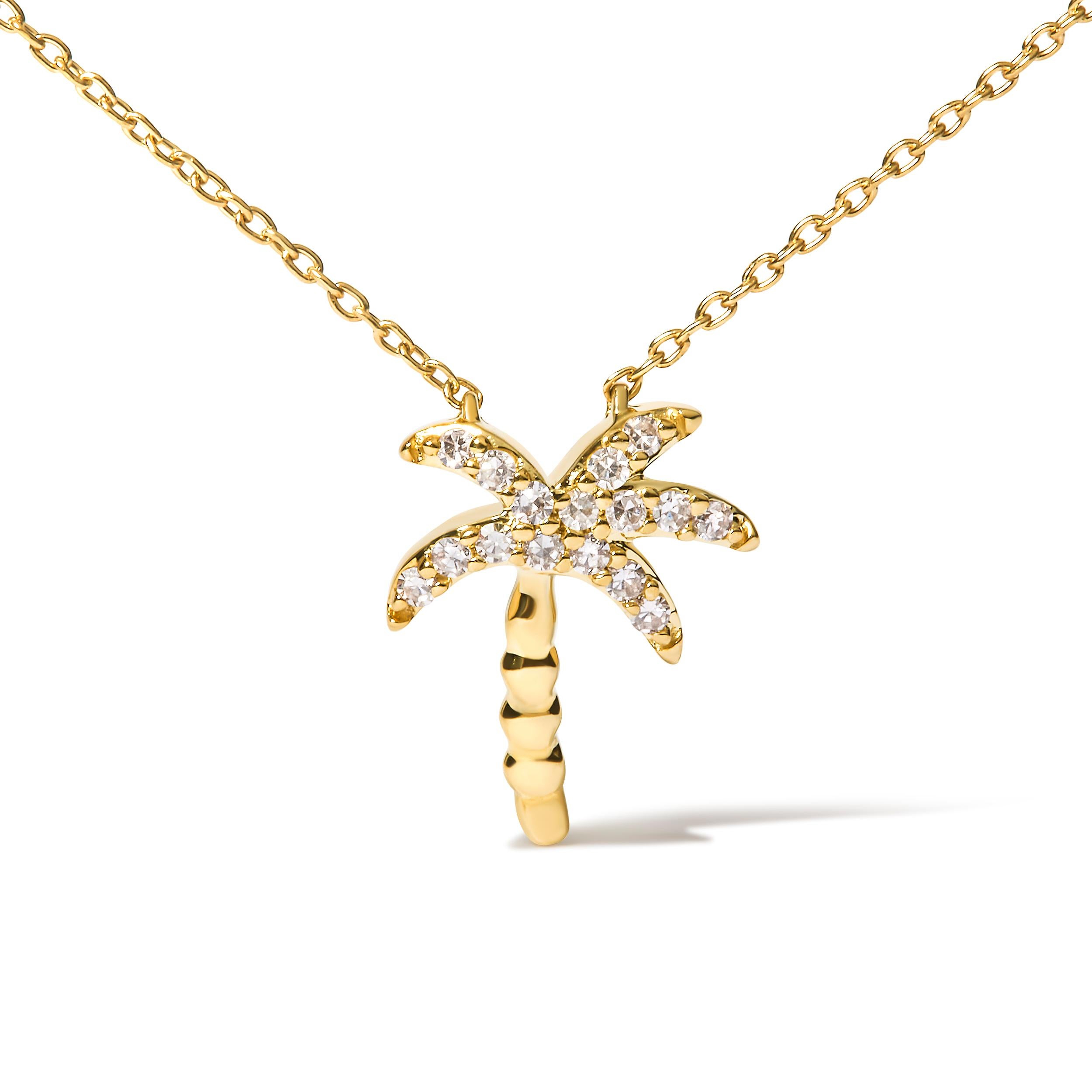 Voici une pièce éblouissante qui incarne l'essence même de la beauté de la nature : un collier à pendentif palmier de 18 pouces. Fabriqué avec la plus grande précision en or jaune 10 carats, ce superbe collier est orné de 16 diamants ronds exquis,