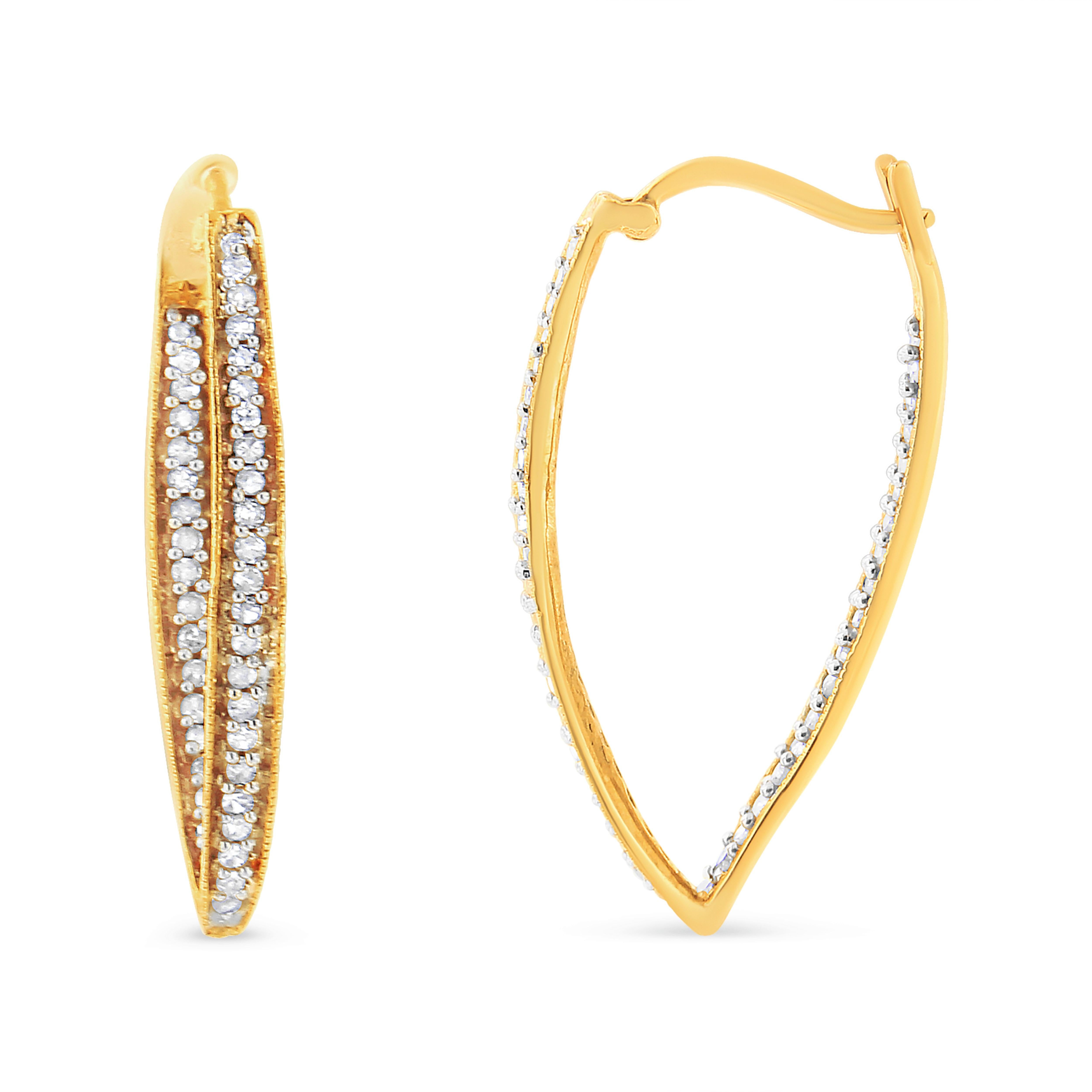 Dress up any outfit with this trendy yet timeless modern hoops. These earrings are crafted in gleaming 10k yellow gold and have an outside-inside design embellished with beautiful, natural diamonds. The diamonds are round-cut and sparkle in an