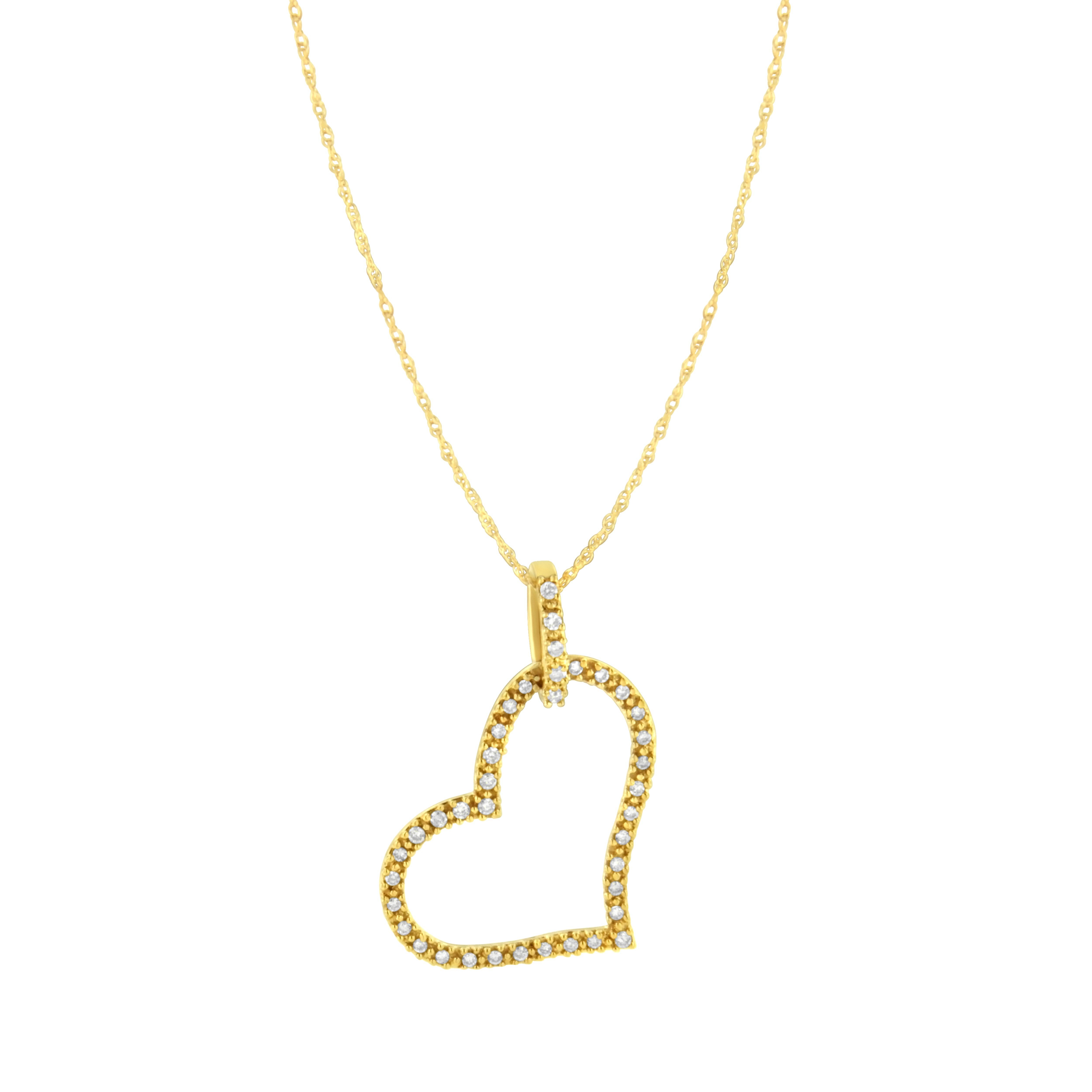This Diamond Heart Pendant makes a charming gift for your sweet heart. The enchanting yellow gold heart hangs askew from a sleek yellow gold bail and is adorned with 39 brilliant round cut diamonds beautifully prong set and rendered with sparkle on