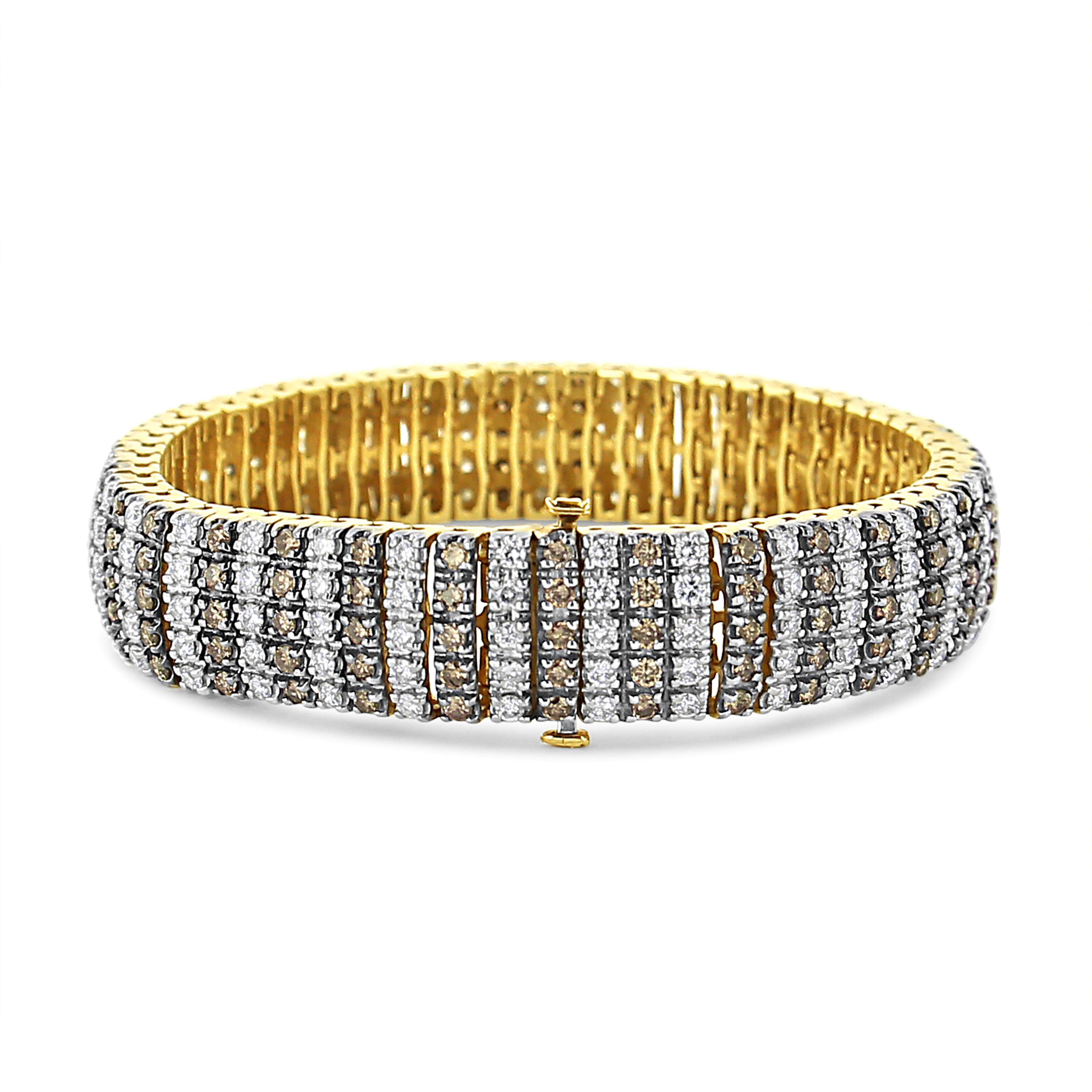 You've never seen glamour like this 10 1/3 carat diamond tennis bracelet. Set in 10k yellow gold sits rows of natural round-cut white diamonds alternating with rows of color-treated brown diamonds in a prong setting. The diamonds shine bright next
