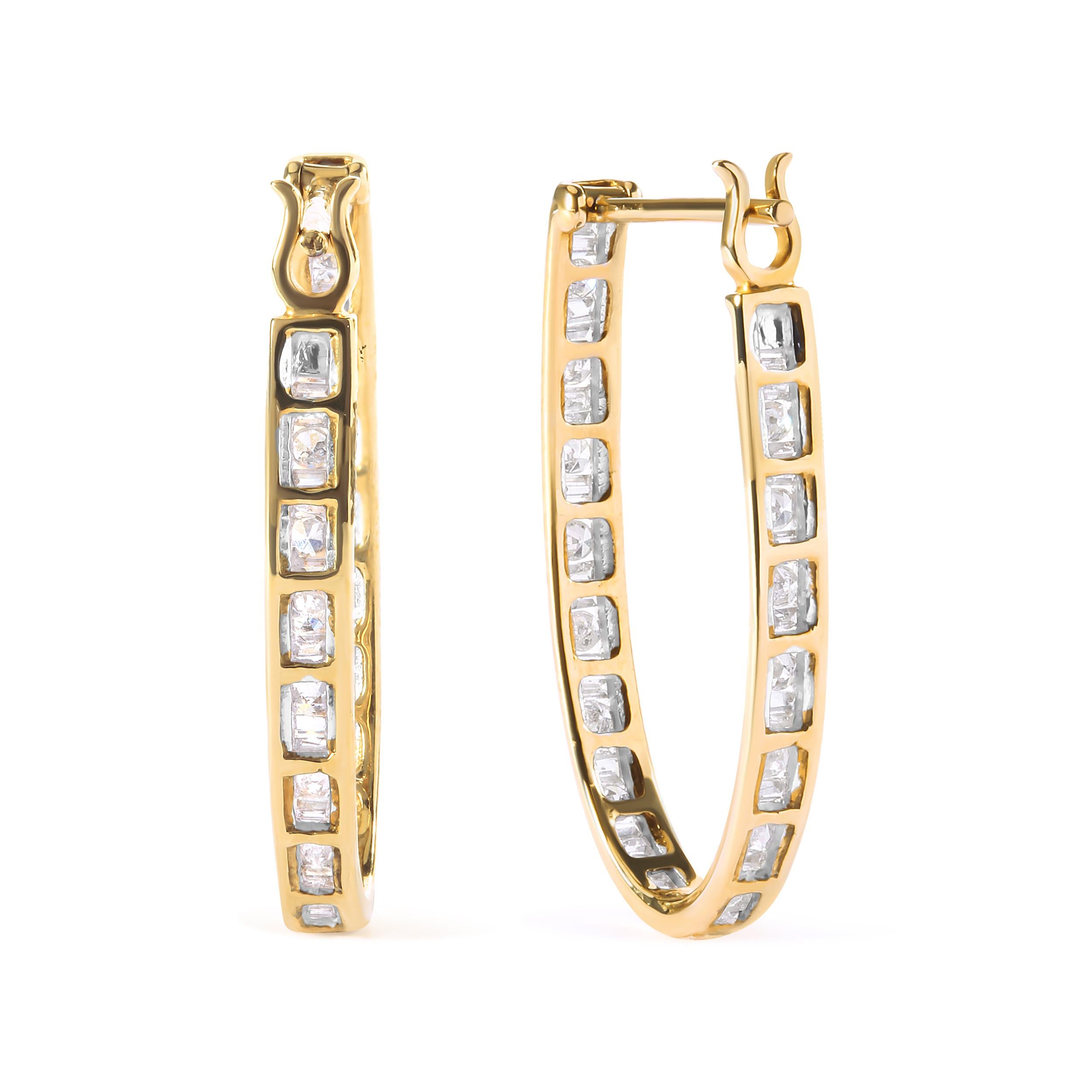 Indulge in the pure luxury of these exquisite 10K yellow gold hoop earrings, a true testament to sophistication and style. Adorned with a total of 96 natural diamonds, including 32 round-cut and 64 baguette-cut diamonds, these earrings boast a total