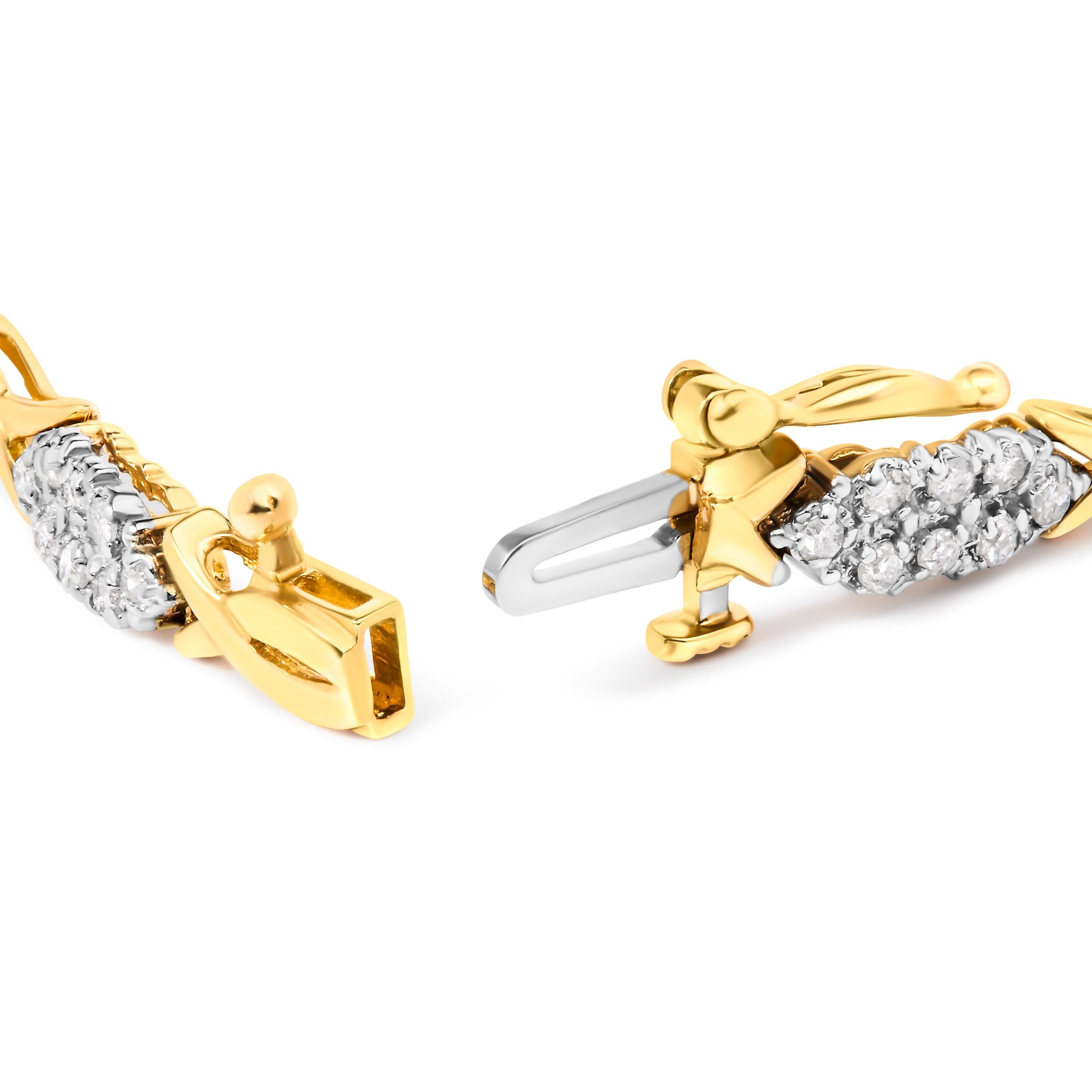 Plongez dans l'allure d'une élégance intemporelle avec ce bracelet exquis en or jaune 10K lustré. Chaque luxueux maillon en spirale exsude une touche de sophistication, conçu de manière complexe pour bercer des diamants ronds brillants. Avec un