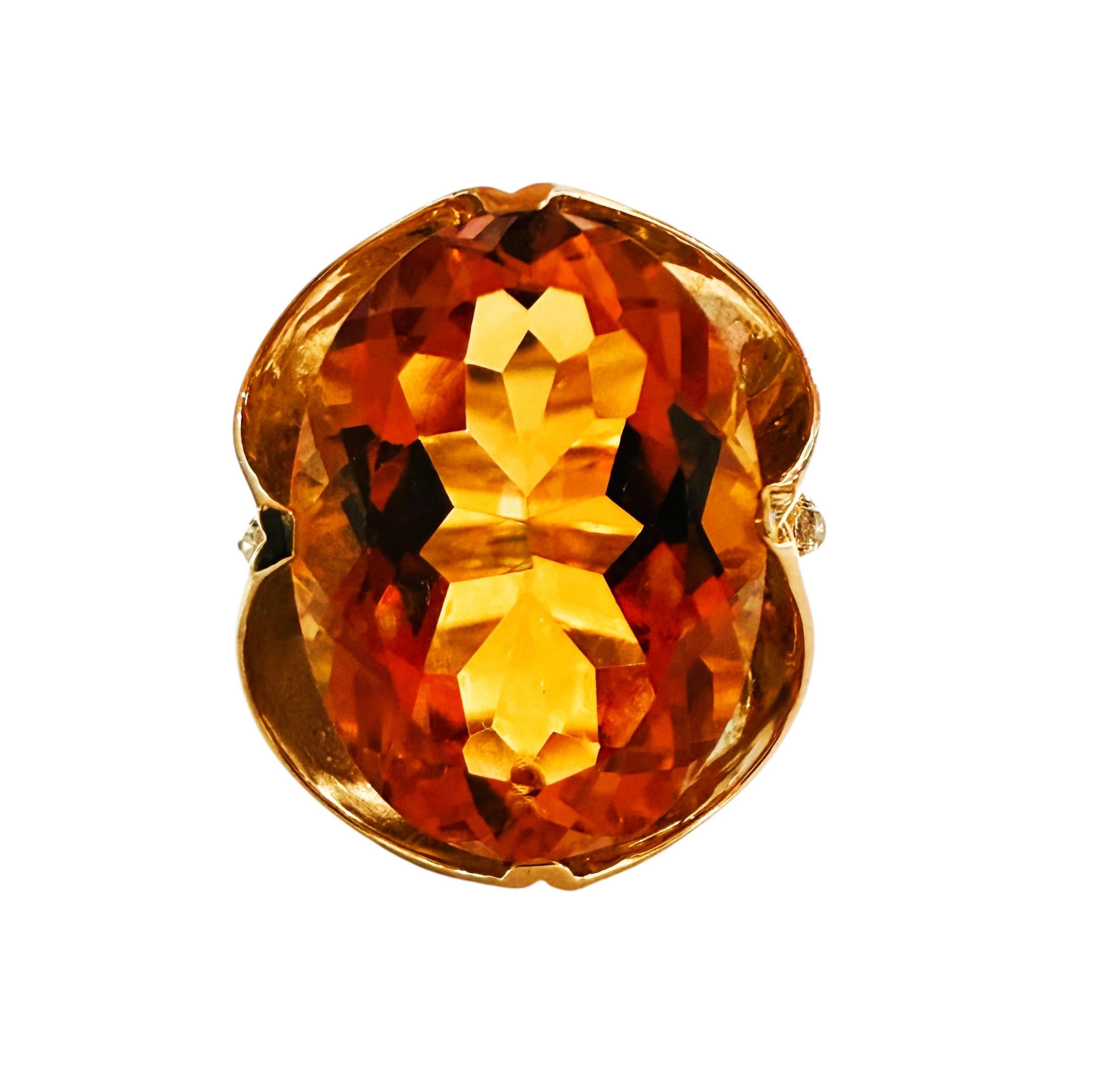 What a beautiful ring!  This stone is just spectacular!  It displays a multitude of colors and is just so striking.  The ring is a size 7.25.  It is a beautiful fancy oval cut stone and is 13.96 carats.  It measures 18 x 15 mm.  It has 2 small