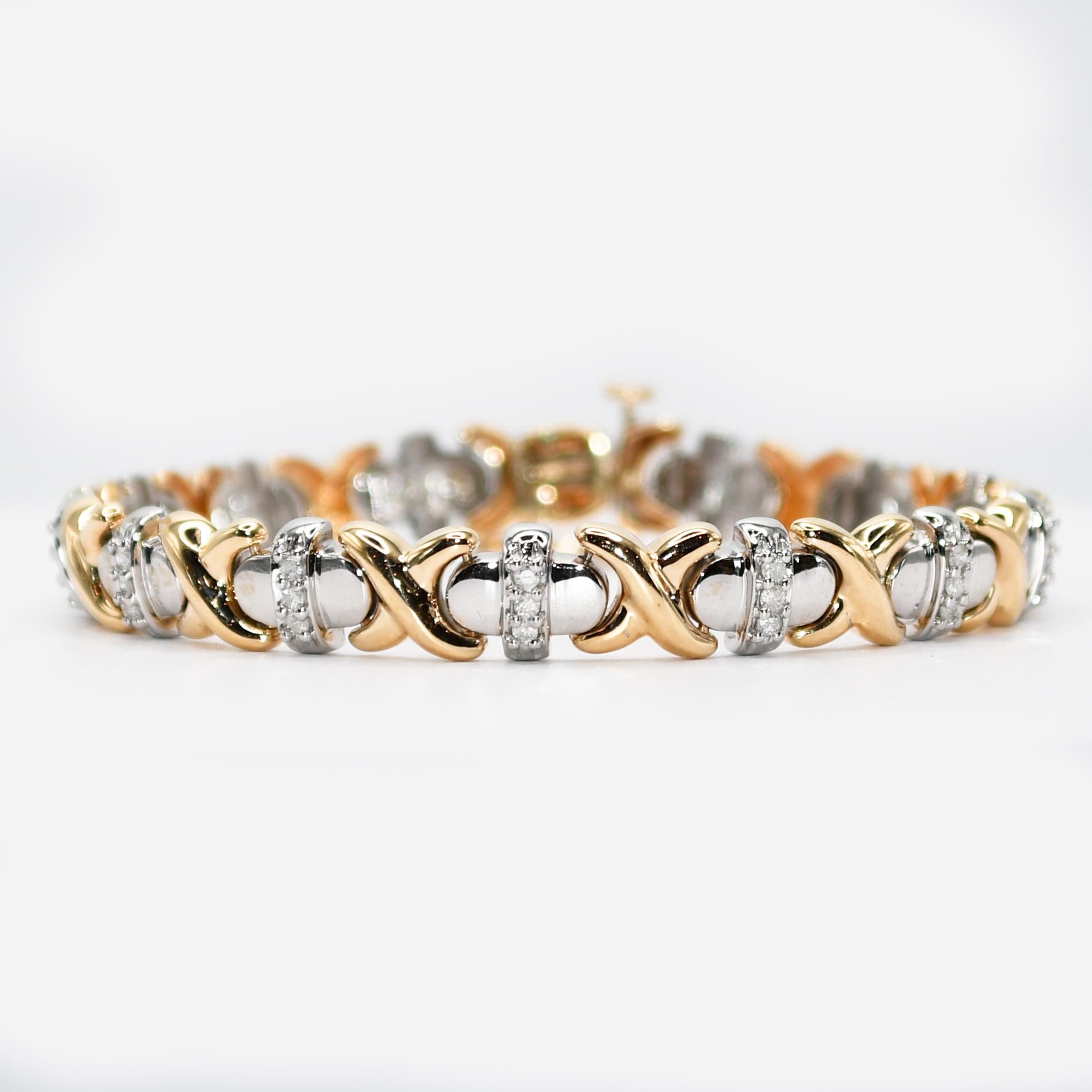 10K Yellow Gold 2 Tone Diamond Bracelet, 1.00tdw, 18.4g
Ladies 14k 2-tone diamond bracelet.
The safety clasp is stamped 14k and the rest tests 14k.
Weighs 18.4 grams.
The diamonds are round brilliant cuts, approximately 1.00 total carats, i to j