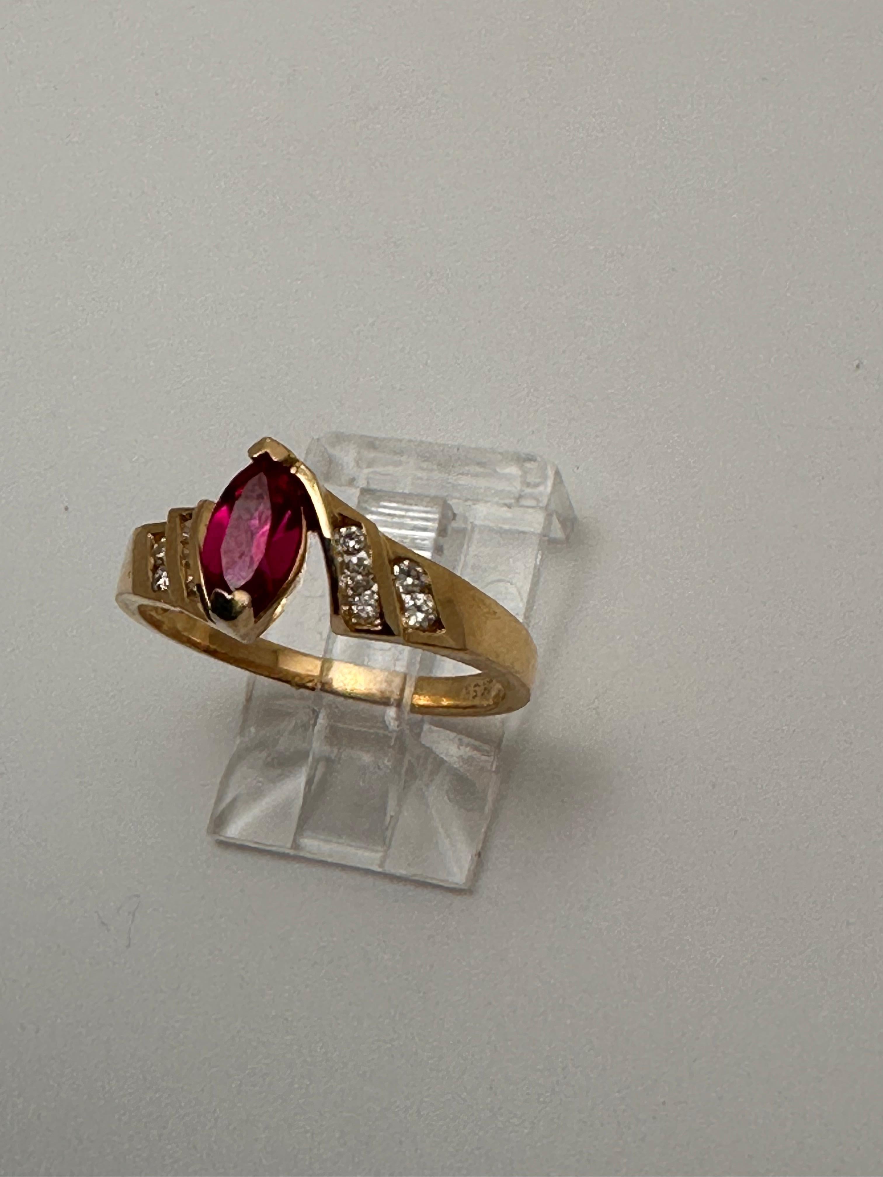 Modern 10k Yellow Gold 4 x 8mm Marquise Ruby with 10 Channel Set Diamonds Ring Size 7 For Sale