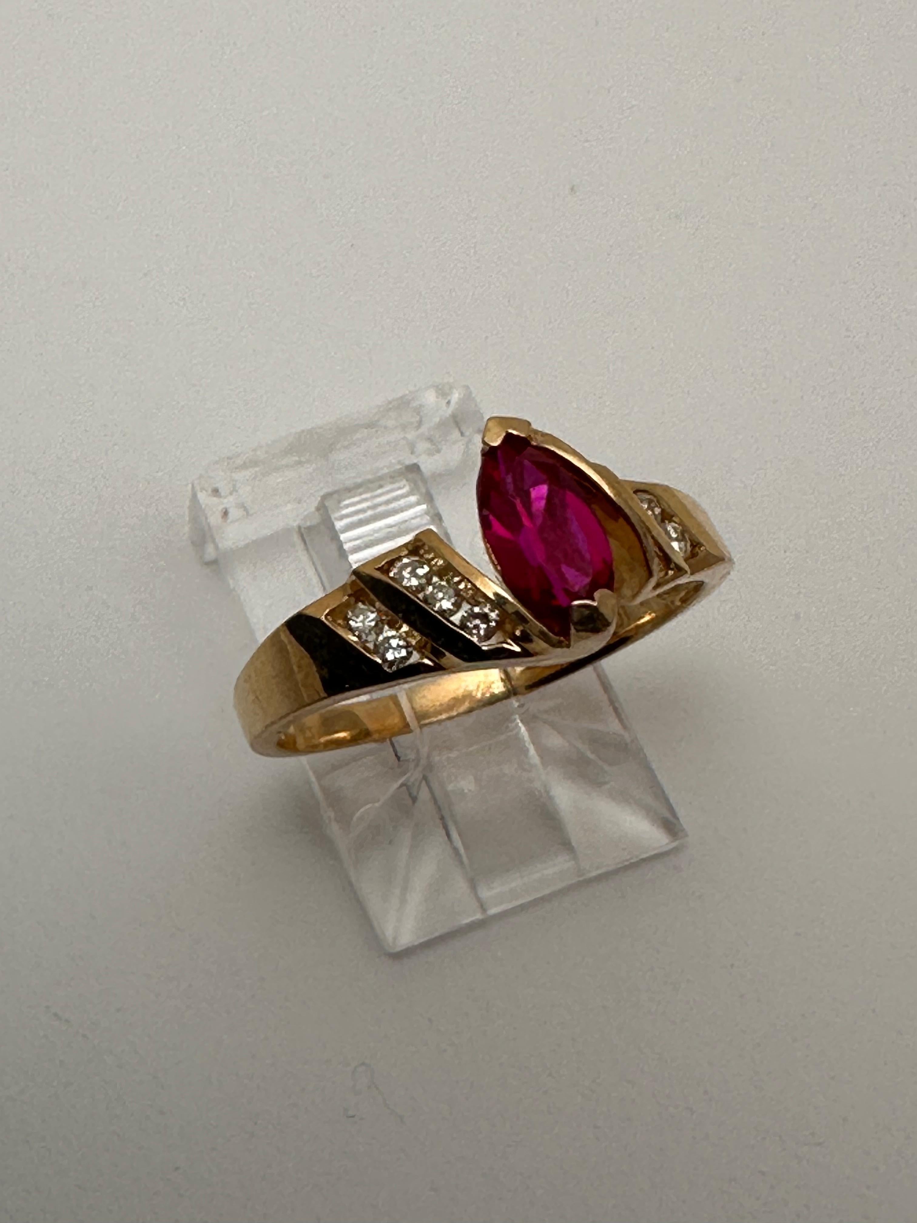 10k Yellow Gold 4 x 8mm Marquise Ruby with 10 Channel Set Diamonds Ring Size 7 In New Condition For Sale In Las Vegas, NV