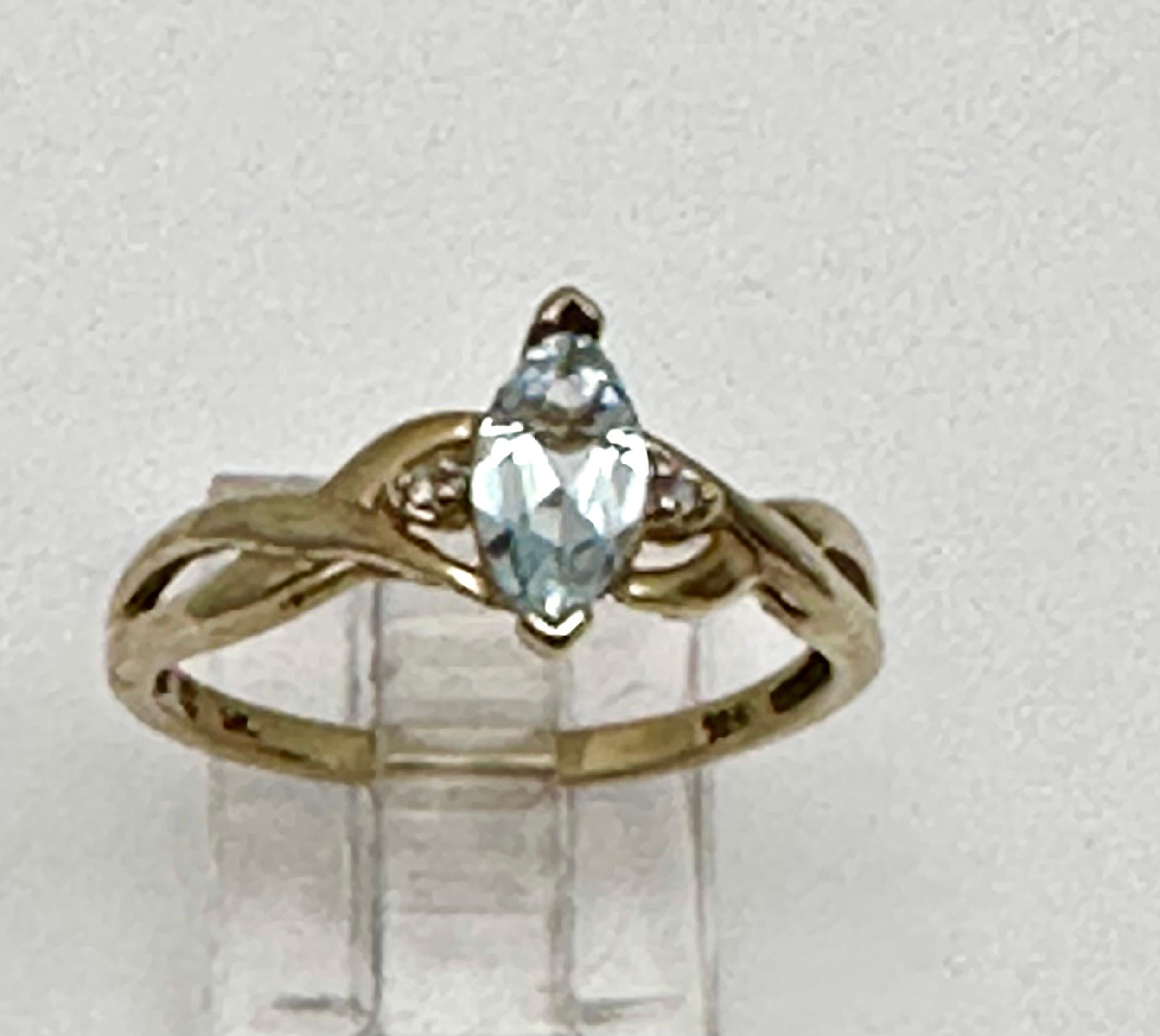 10k Yellow Gold 4mm x 8mm Marquise Blue Topaz Diamond Ring Size 7 In New Condition For Sale In Las Vegas, NV