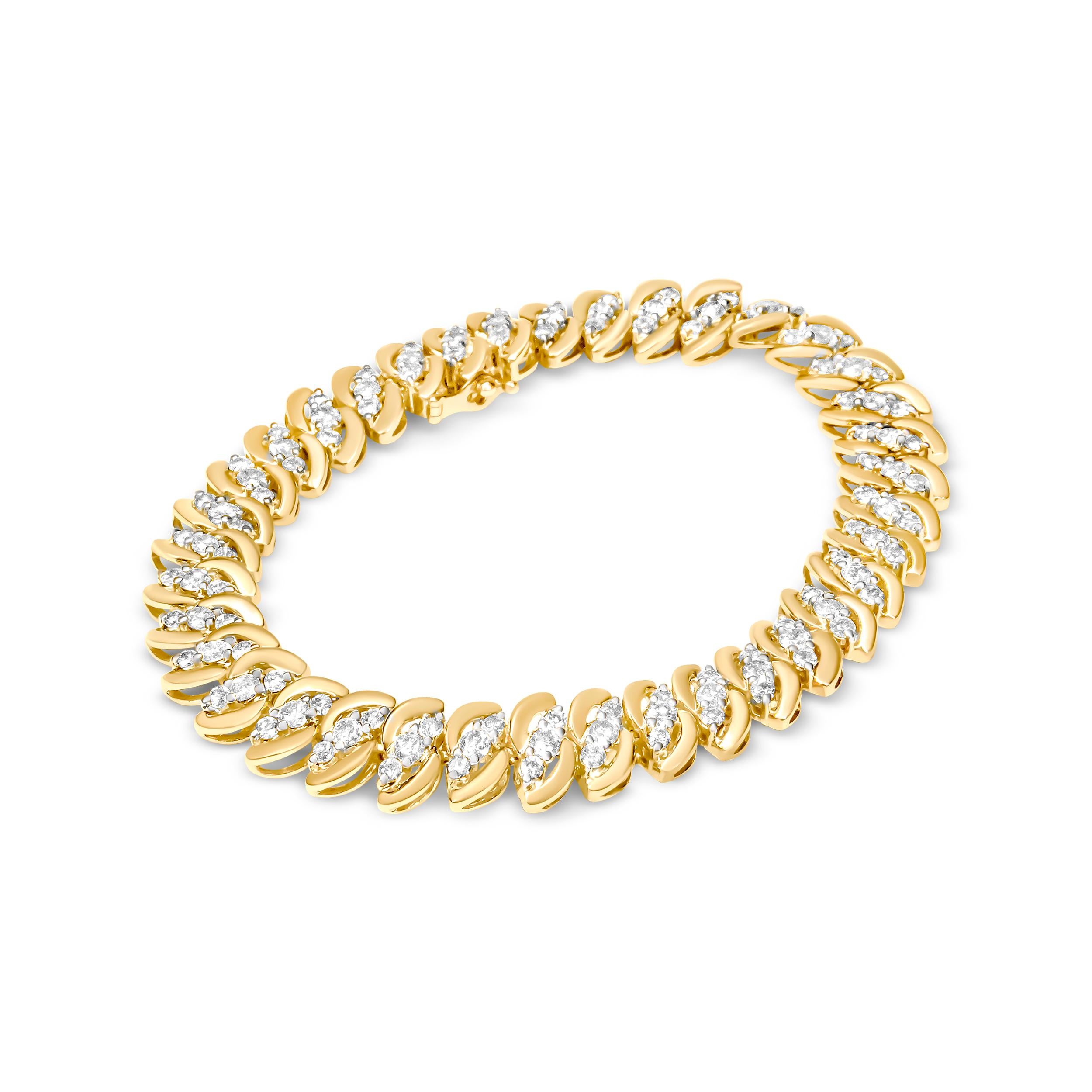 Make a statement with this luxurious 10K yellow gold bracelet. The double row of natural, round-cut diamonds adds a touch of sparkle to any outfit, with a total weight of 5 carats and a color range of J-K and clarity of I2-I3. The bracelet features