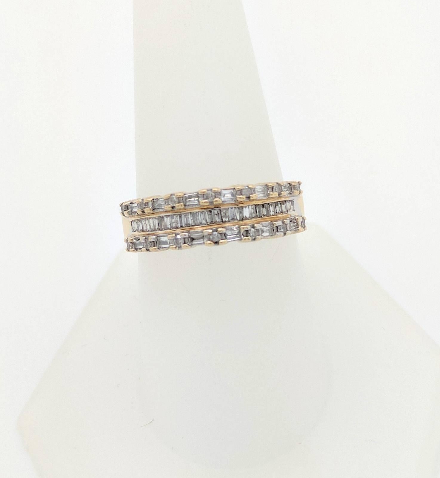 Ladies 10K Yellow Gold .50CTW Diamond Band Size 9

You are viewing a beautiful diamond band. This band is crafted from 10k yellow gold and weigh 3.4 grams. This ring features (28) baguette cut natural diamonds, (14) round natural diamonds and (12)