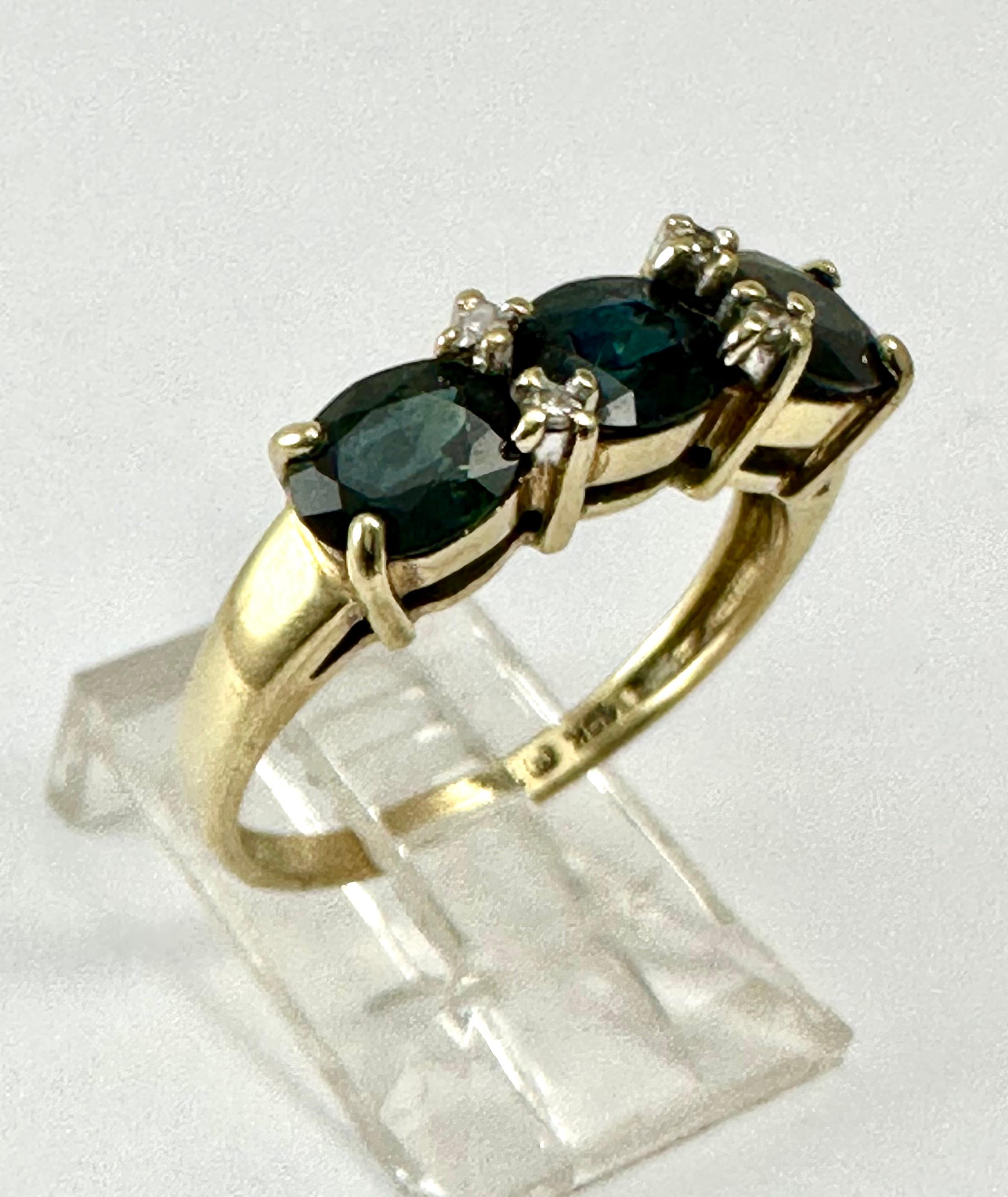 10k Yellow Gold ~ 5.2 Wide ~ Sapphire and Diamond ~ Band ~ Ring ~ Size 7
Oval sapphires measure approx. 4.5mm x 6mm

Meaning: Sapphire is a stone of wisdom and royalty, often associated with sacred things and considered the gem of gems, guiding