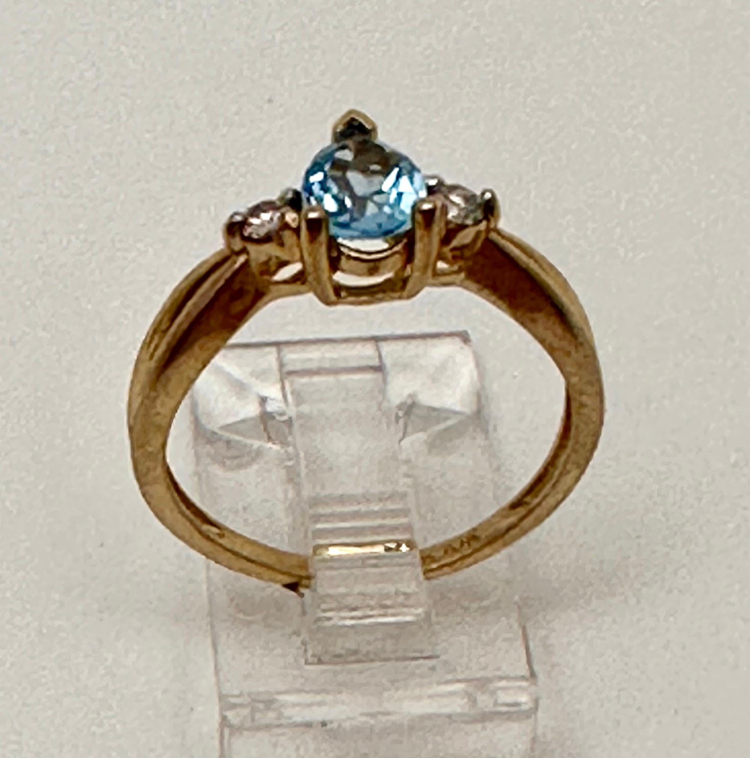 Women's 10k Yellow Gold 5mm x 7mm Pear Blue Topaz 2 Round Diamond Ring Size 7 For Sale